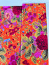 Kaffe Fassett Collective Gradi Floral Tomato fabric by Philip Jacobs for Free Spirit Fabrics featuring large bold floral blooms in pink and purple on a red background.