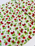 Ambrosia Farm Berry Picking Natural fabric by RJR Studio for RJR Fabrics featuring red strawberries, green leaves, and white flowers on a cream grid background.