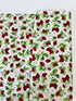 Ambrosia Farm Berry Picking Natural fabric by RJR Studio for RJR Fabrics featuring red strawberries, green leaves, and white flowers on a cream grid background.