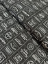 The Print Shop Modern Logos Black fabric by Sweetwater for Moda Fabrics featuring white vintage typography logos on a black background.