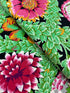 Kaffe Fassett Collective Vintage Flower Lattice Jewel fabric by Philip Jacobs for Free Spirit Fabrics featuring bold pink and green floral pattern on black background.