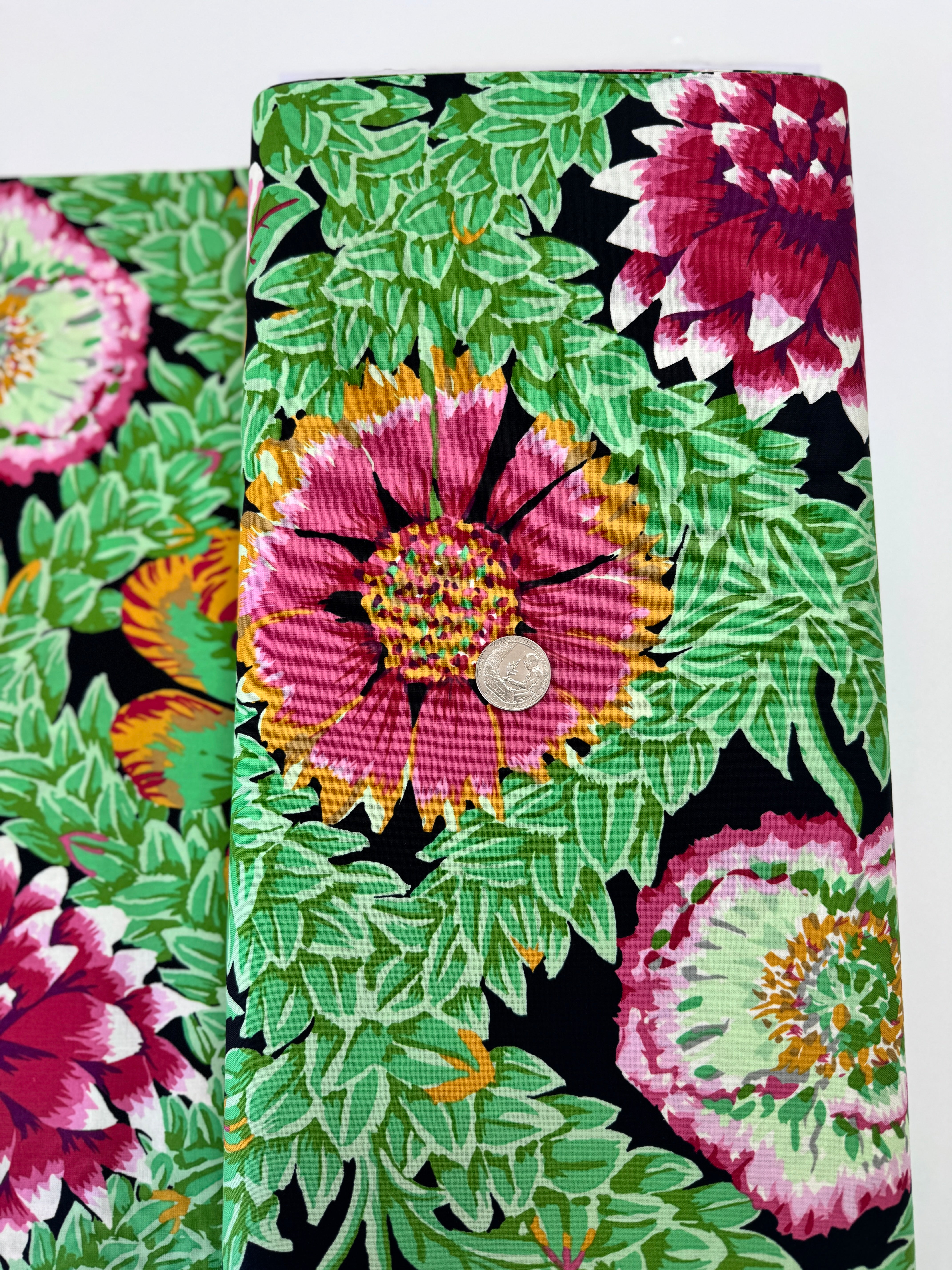 Kaffe Fassett Collective Vintage Flower Lattice Jewel fabric by Philip Jacobs for Free Spirit Fabrics featuring bold pink and green floral pattern on black background.