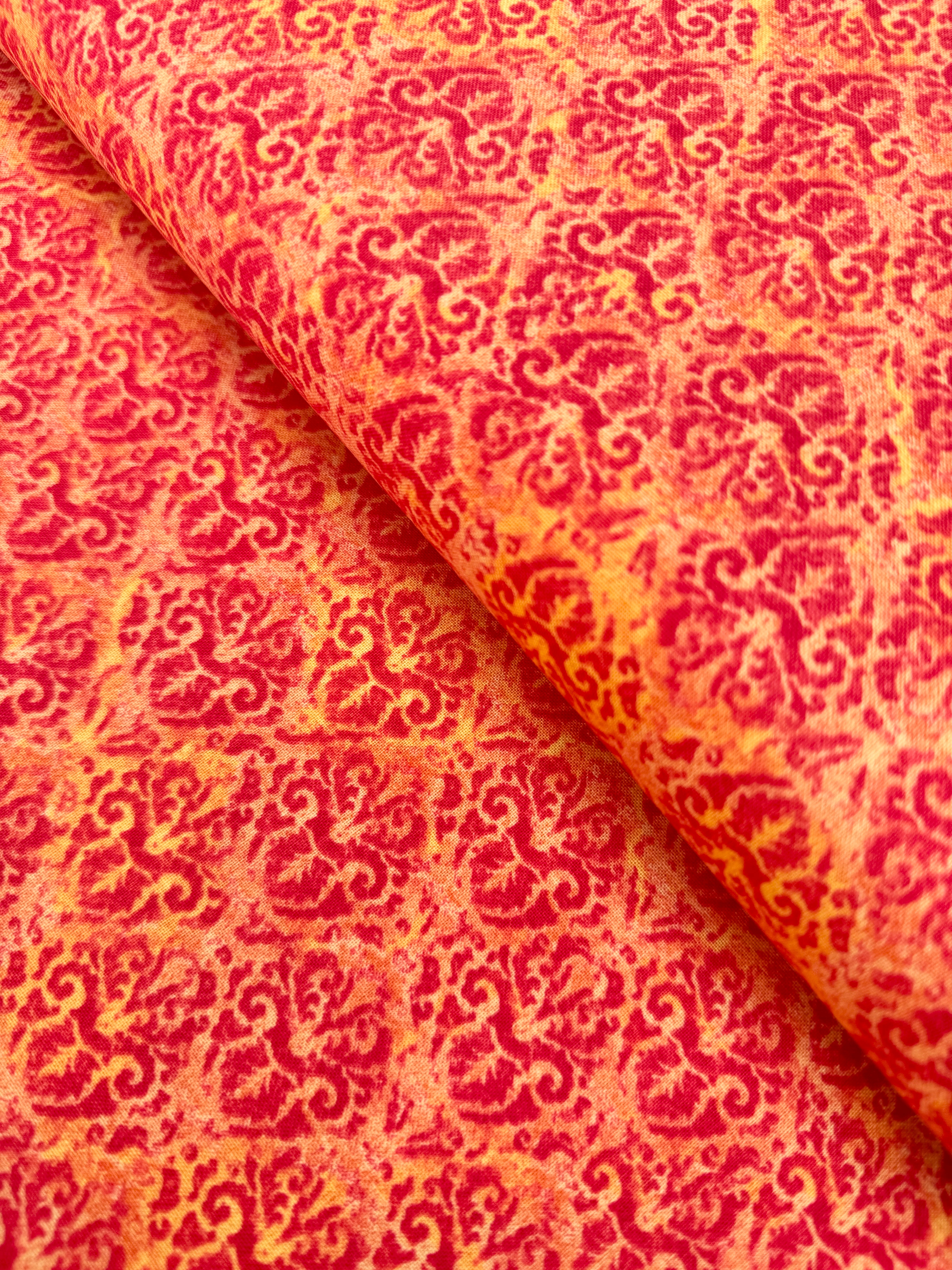 Blossom & Bloom Nouveau Damask Orange Fabric by John Christopher for Wilmington Prints featuring elegant orange damask motifs on a peach background.