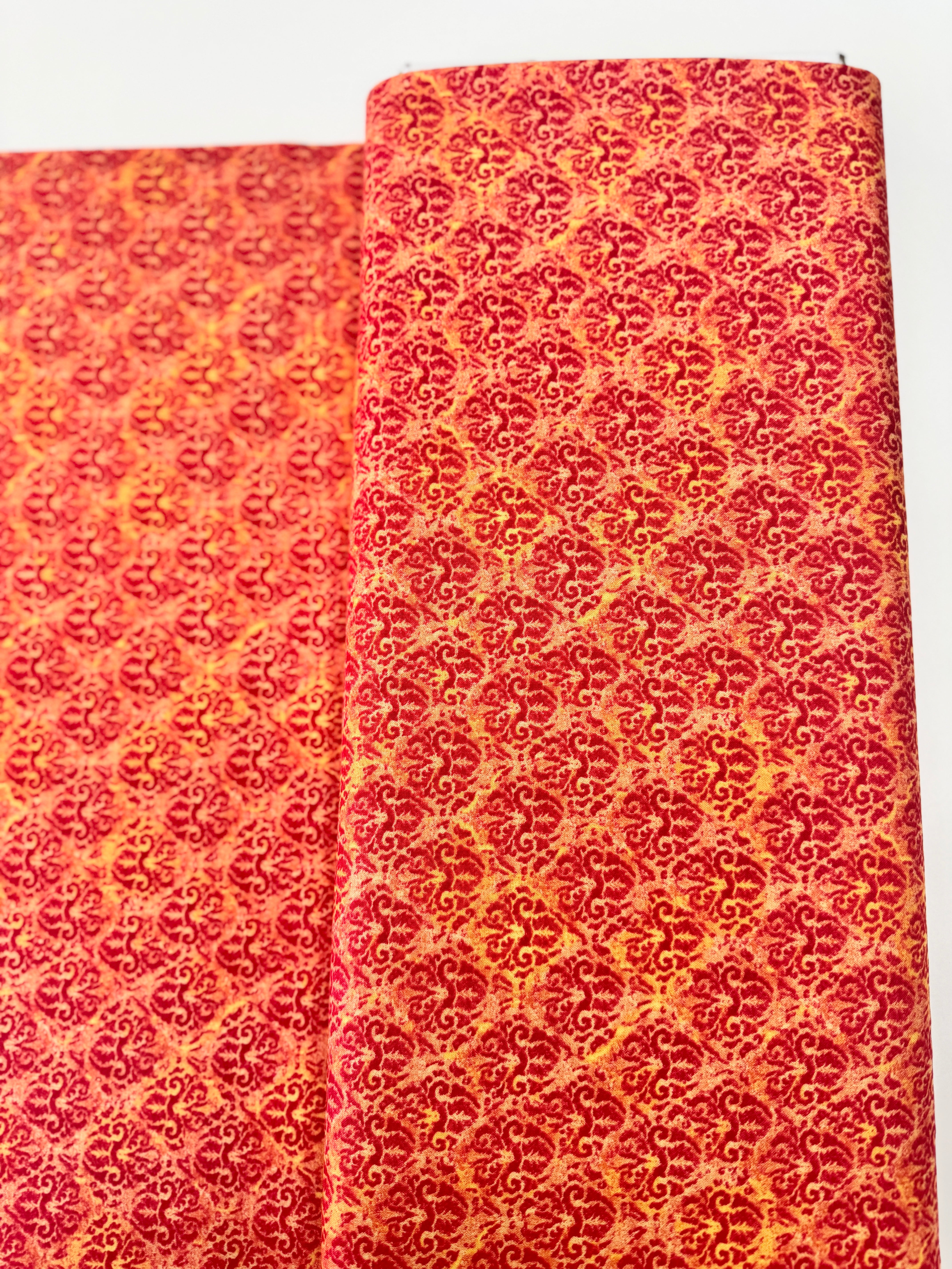 Blossom & Bloom Nouveau Damask Orange Fabric by John Christopher for Wilmington Prints featuring elegant orange damask motifs on a peach background.