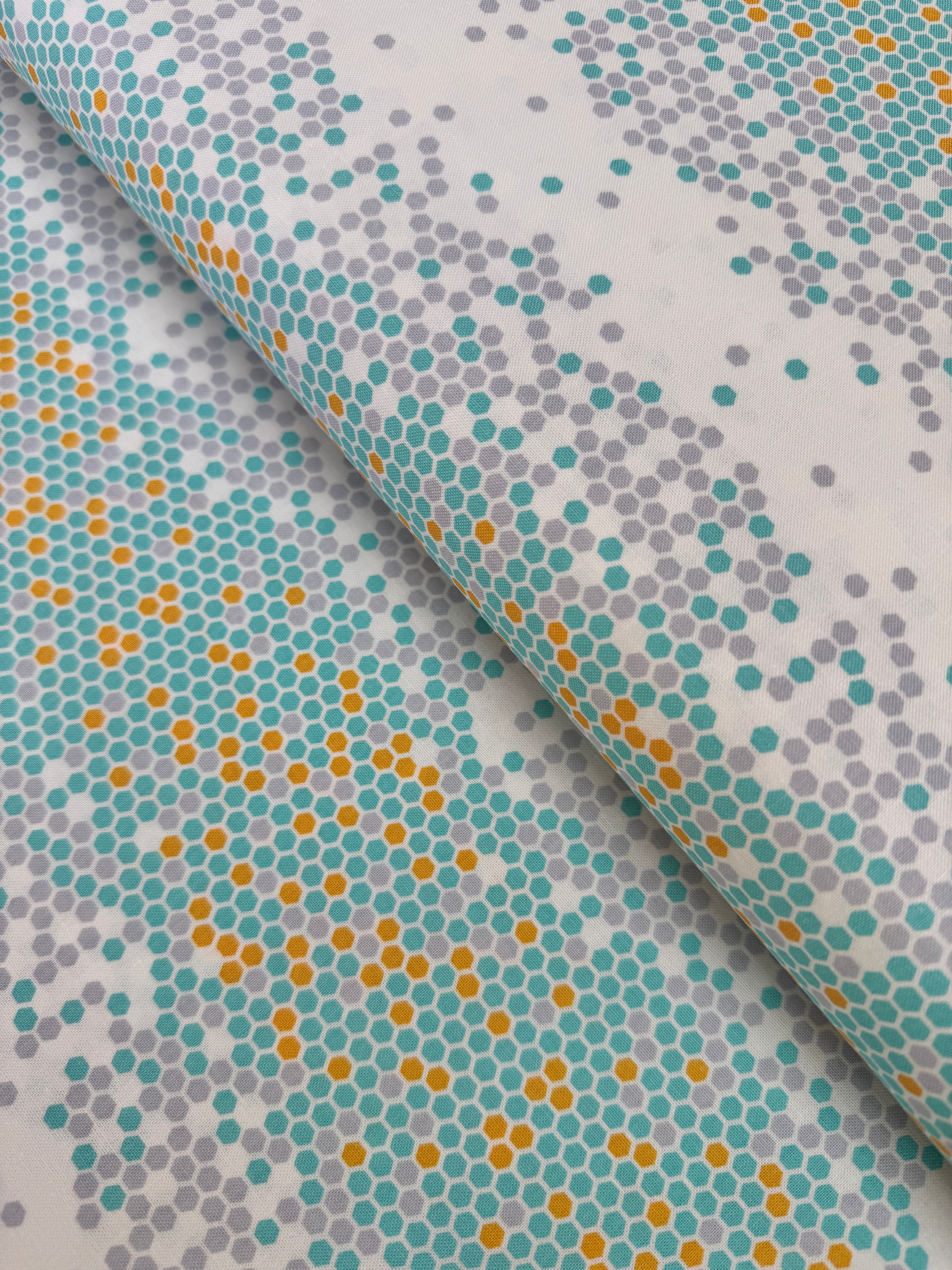 Atrium - Hexapoint Mint Fabric by Joel Dewberry for Free Spirit Fabrics featuring mint, gray, and yellow hexagonal geometric pattern on white background.