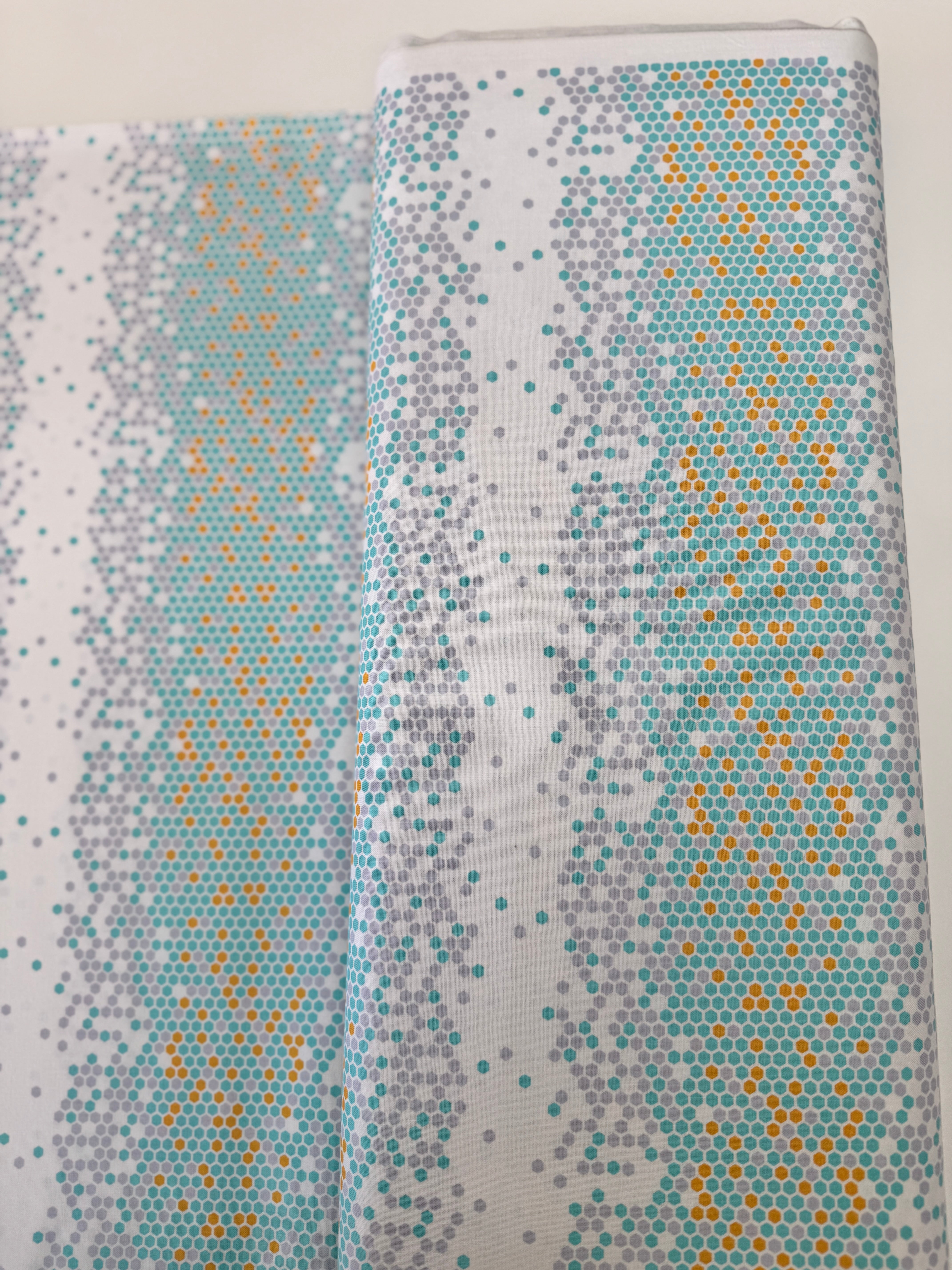 Atrium - Hexapoint Mint Fabric by Joel Dewberry for Free Spirit Fabrics featuring mint, gray, and yellow hexagonal geometric pattern on white background.