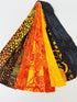 Assorted Halloween batik scrap strip bundle in orange, black, and gold tones, 2-inch strips by Island Batik.
