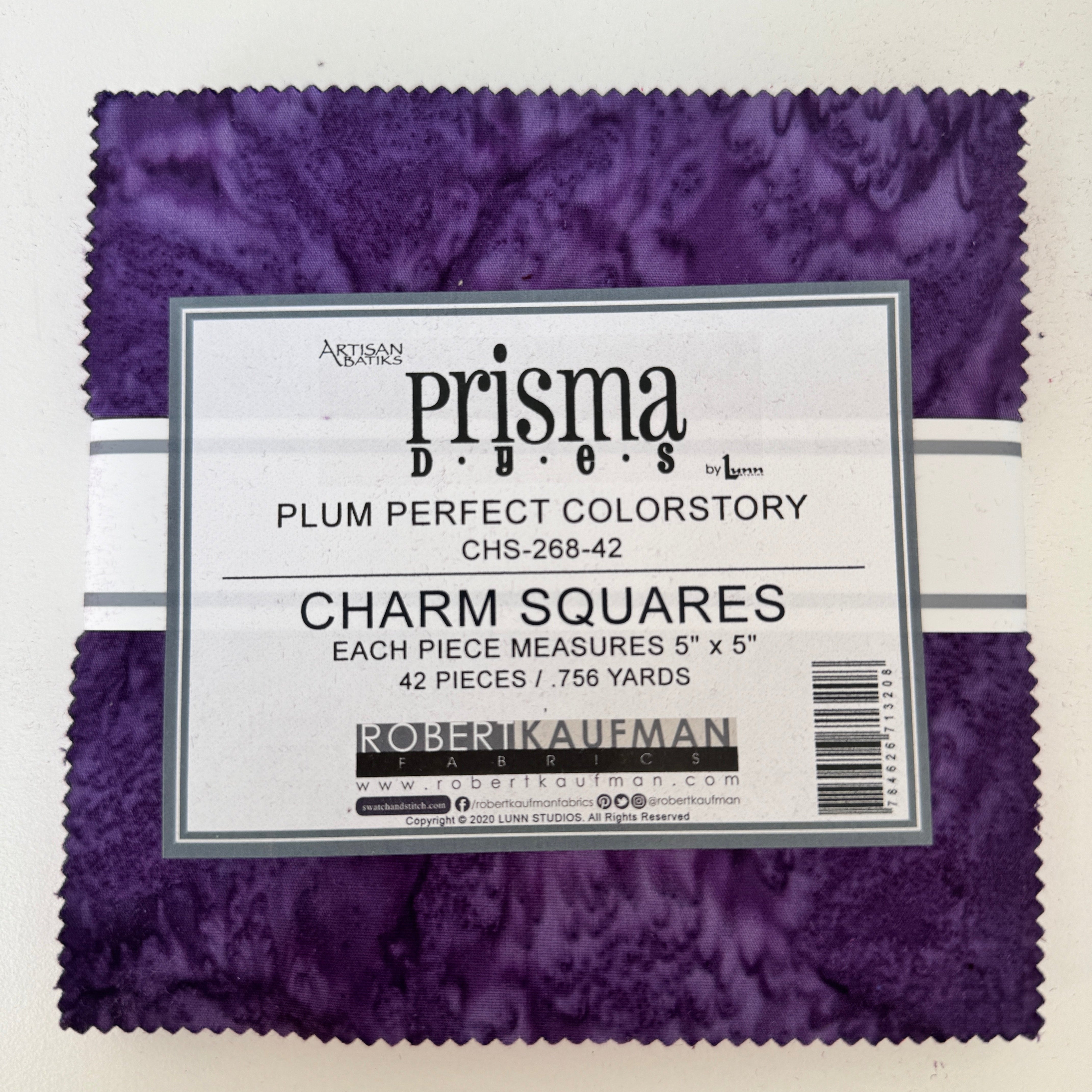 Prisma Dyes Plum Perfect charm pack with hand-dyed purple 5-inch batik squares by Robert Kaufman.