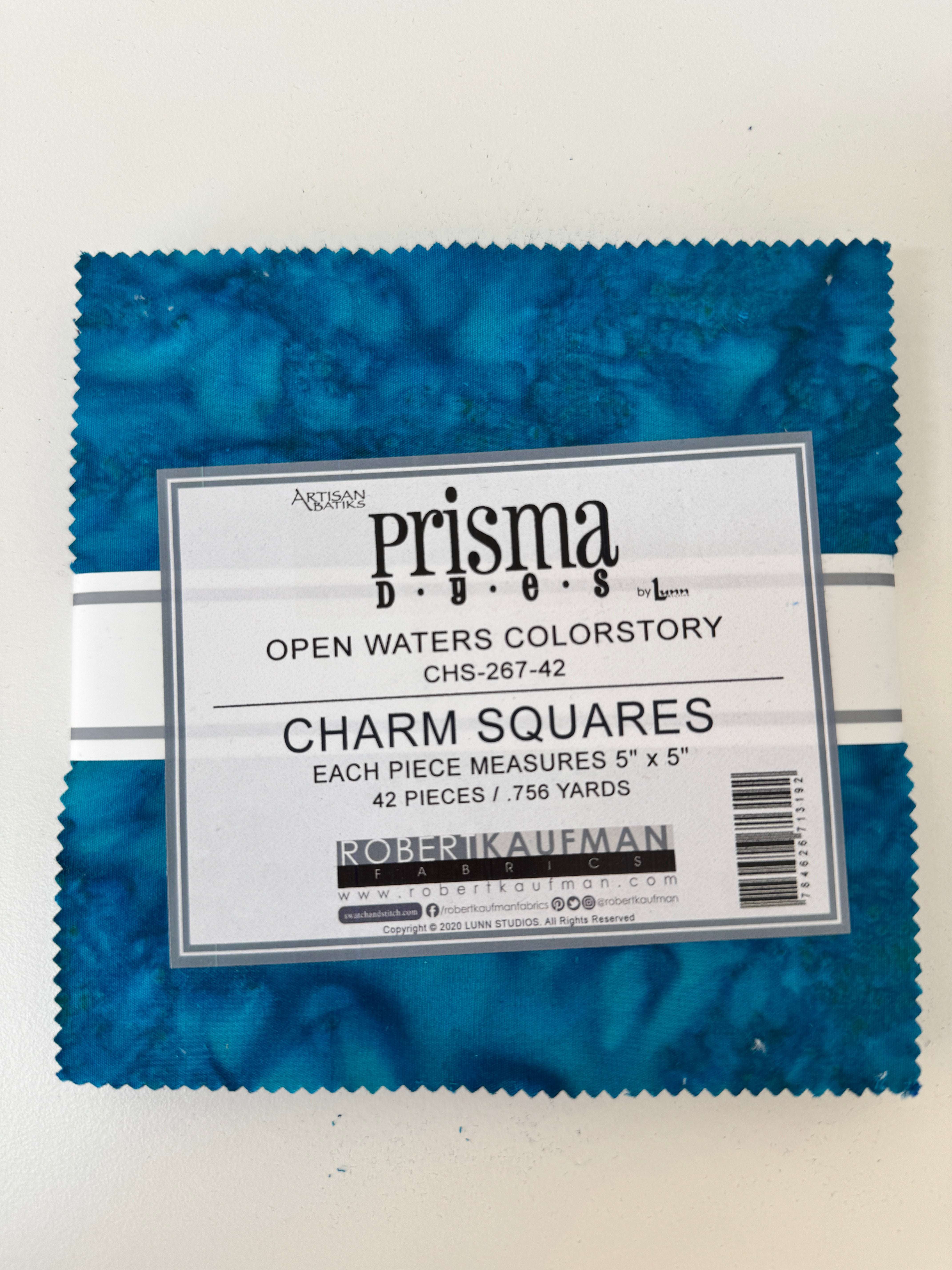 Prisma Dyes Open Waters charm pack by Robert Kaufman with ocean blue 5" batik squares.