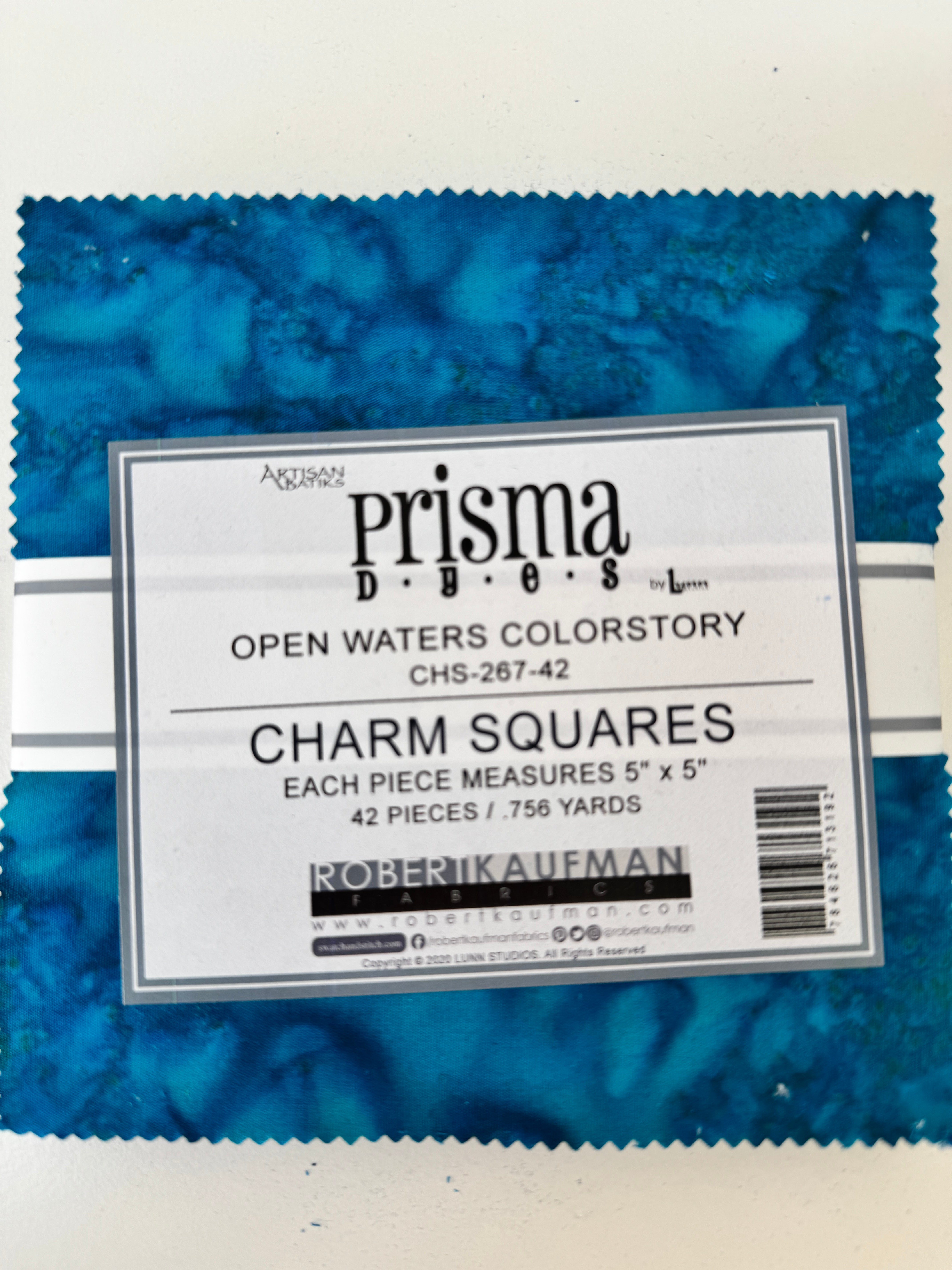 Prisma Dyes Open Waters charm pack by Robert Kaufman with ocean blue 5" batik squares.
