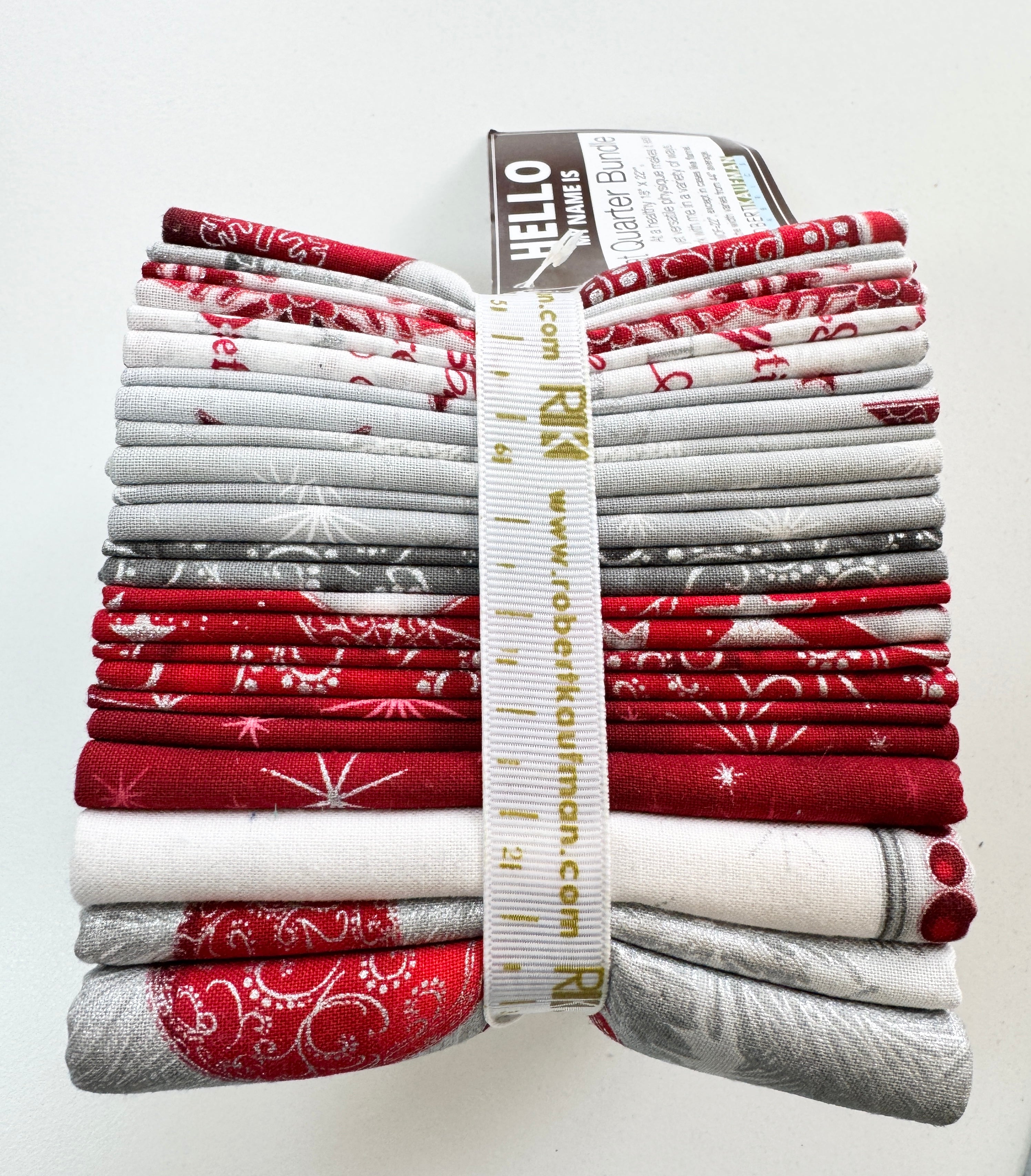 Winter’s Grandeur winter colorstory fat quarter bundle with red, gray, and white holiday quilting cotton fabrics