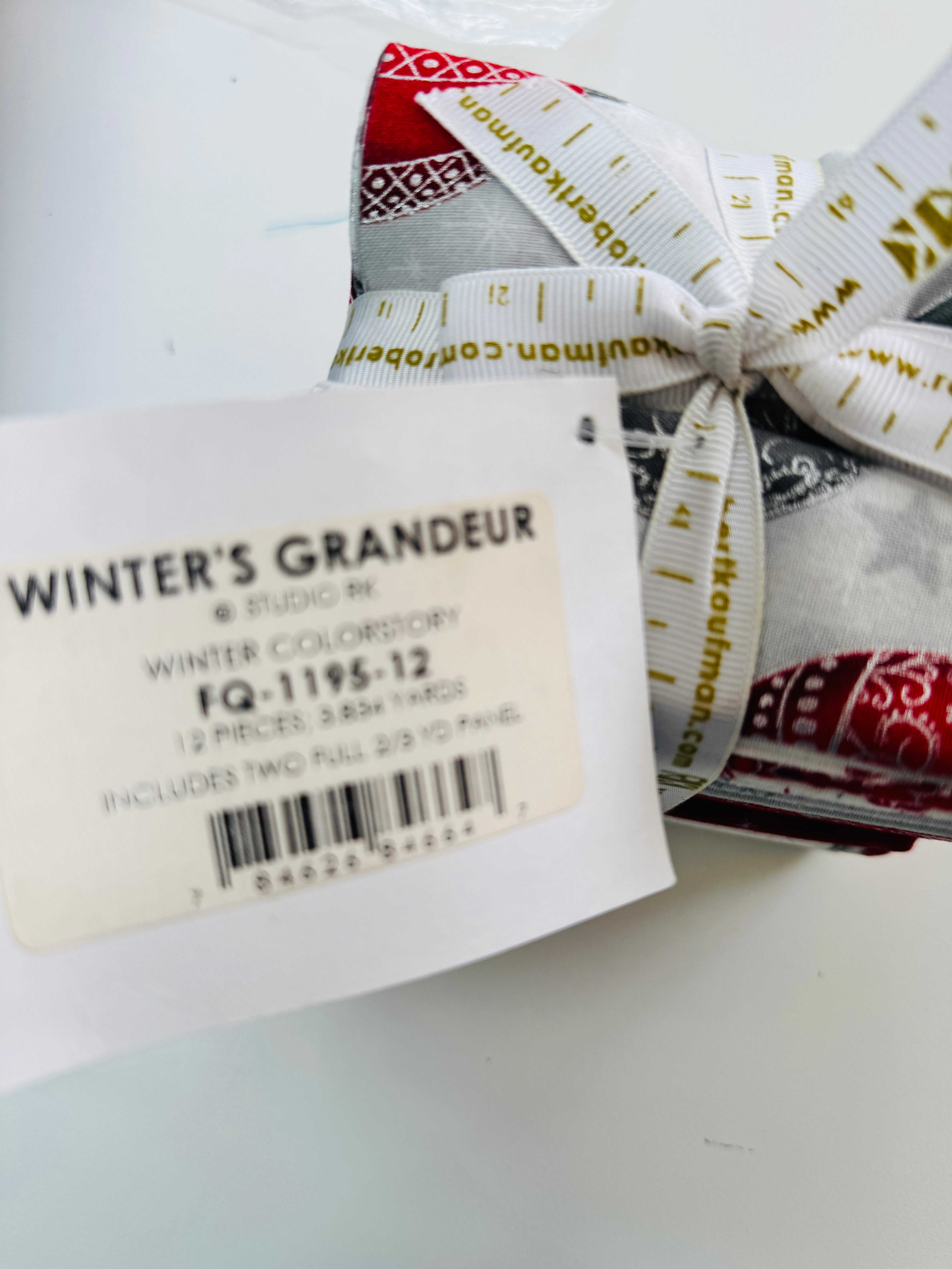 Winter’s Grandeur winter colorstory fat quarter bundle with red, gray, and white holiday quilting cotton fabrics