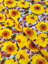 Sunshine Bloom Yellow floral fabric with bright golden flowers and red centers.