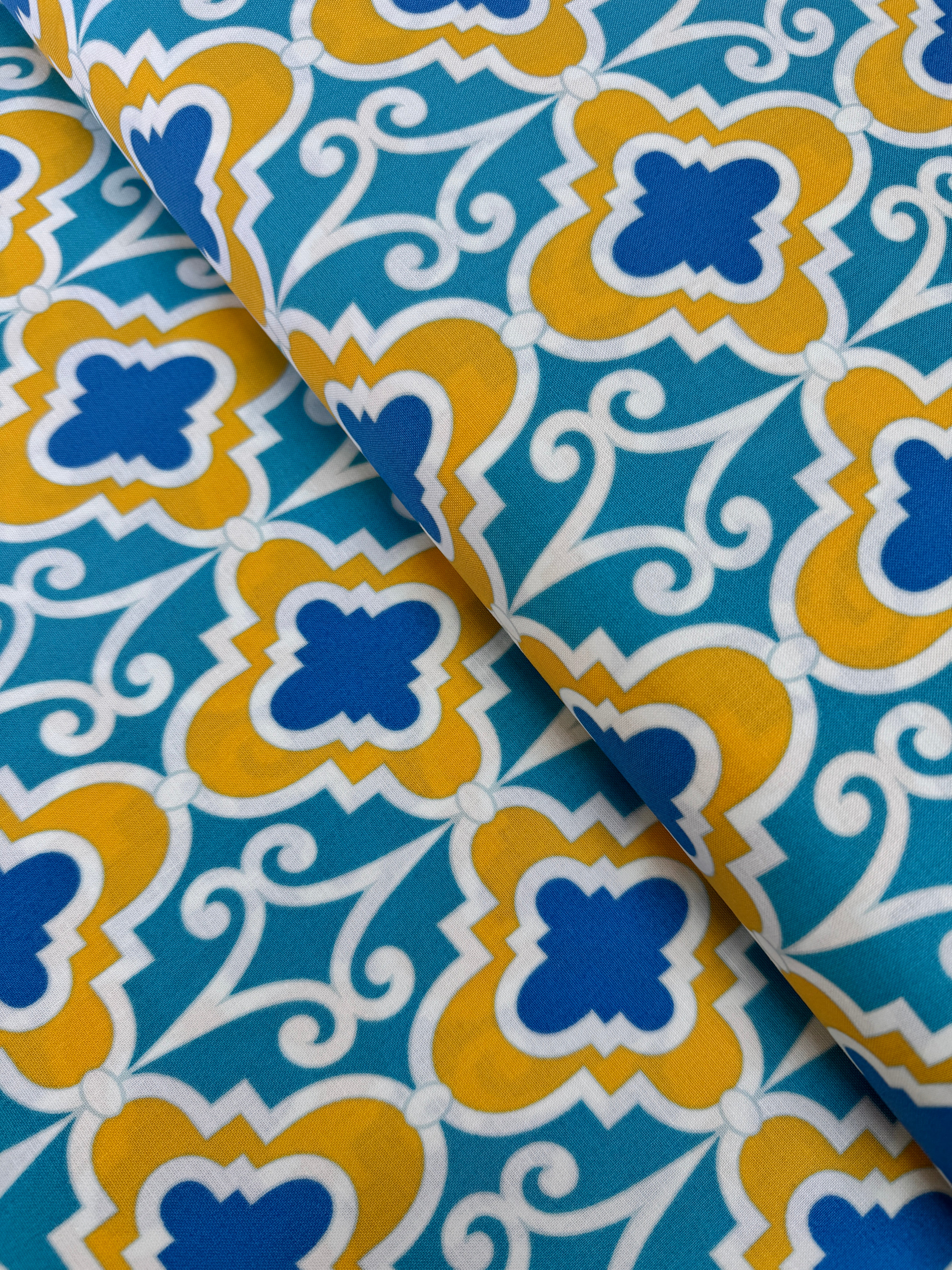 Turquoise lattice geometric cotton fabric with mustard and blue by Dena Designs.