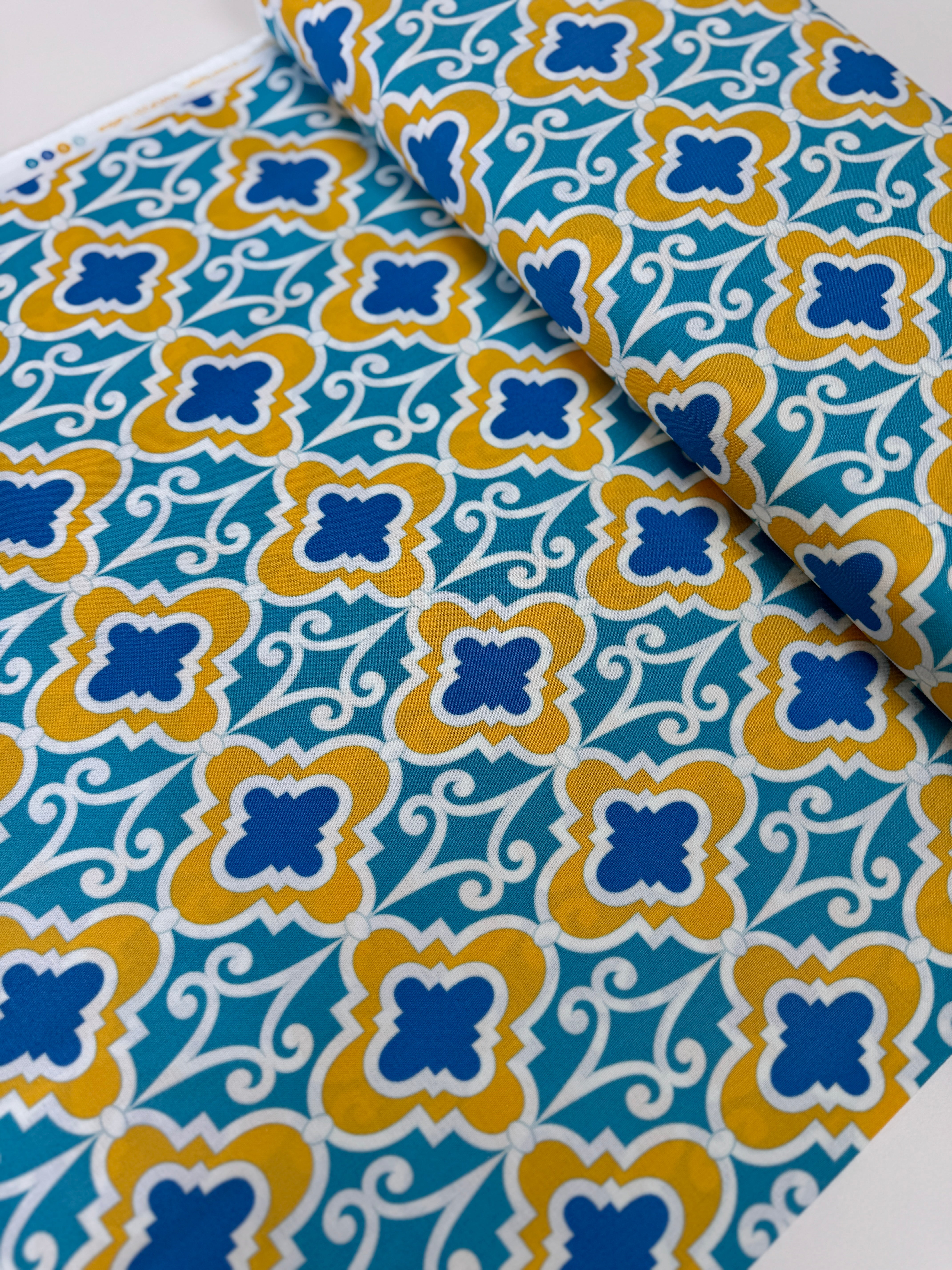 Turquoise lattice geometric cotton fabric with mustard and blue by Dena Designs.
