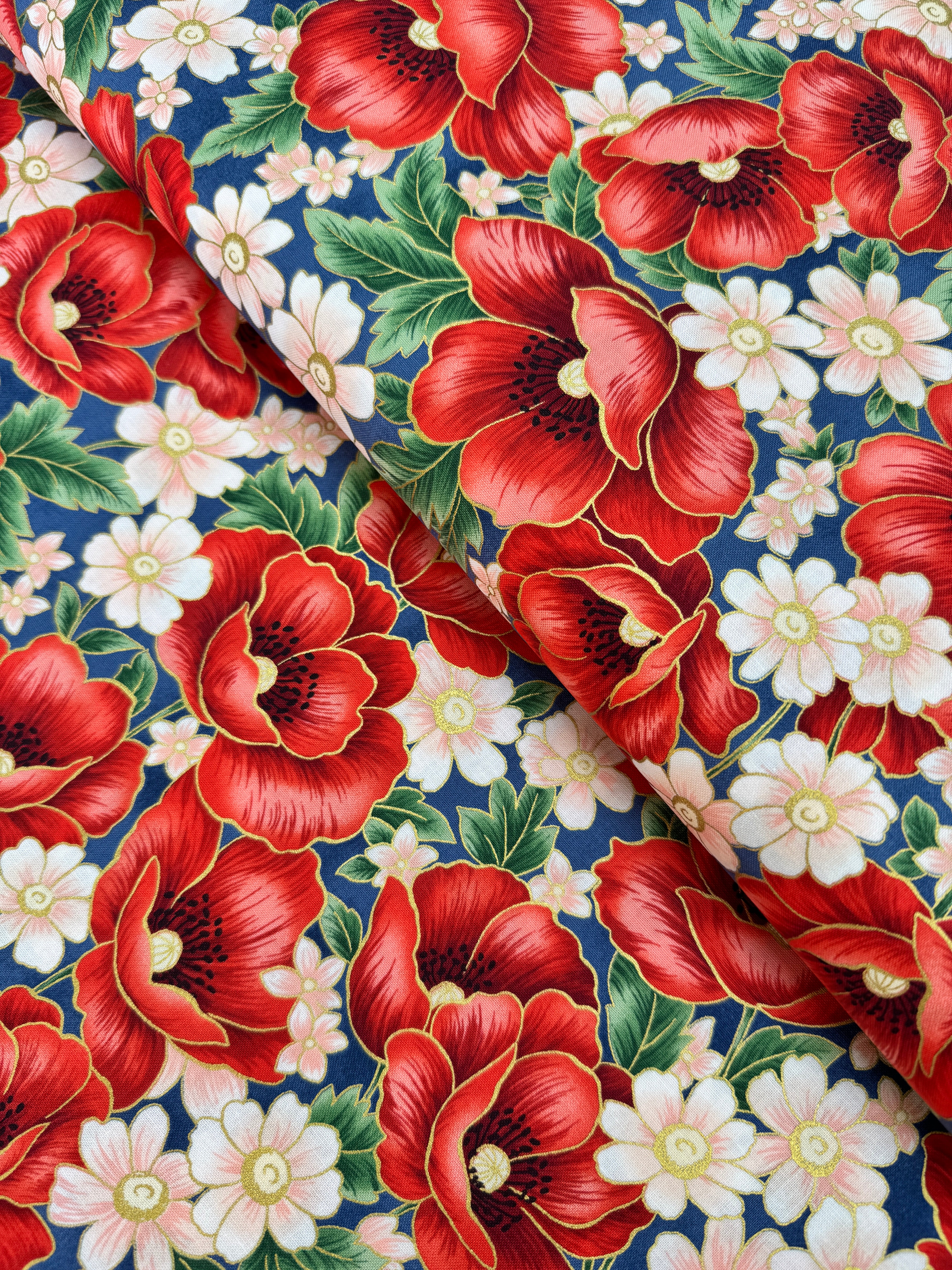 Blue metallic floral quilting cotton fabric with red poppy bouquets by Studio RK.
