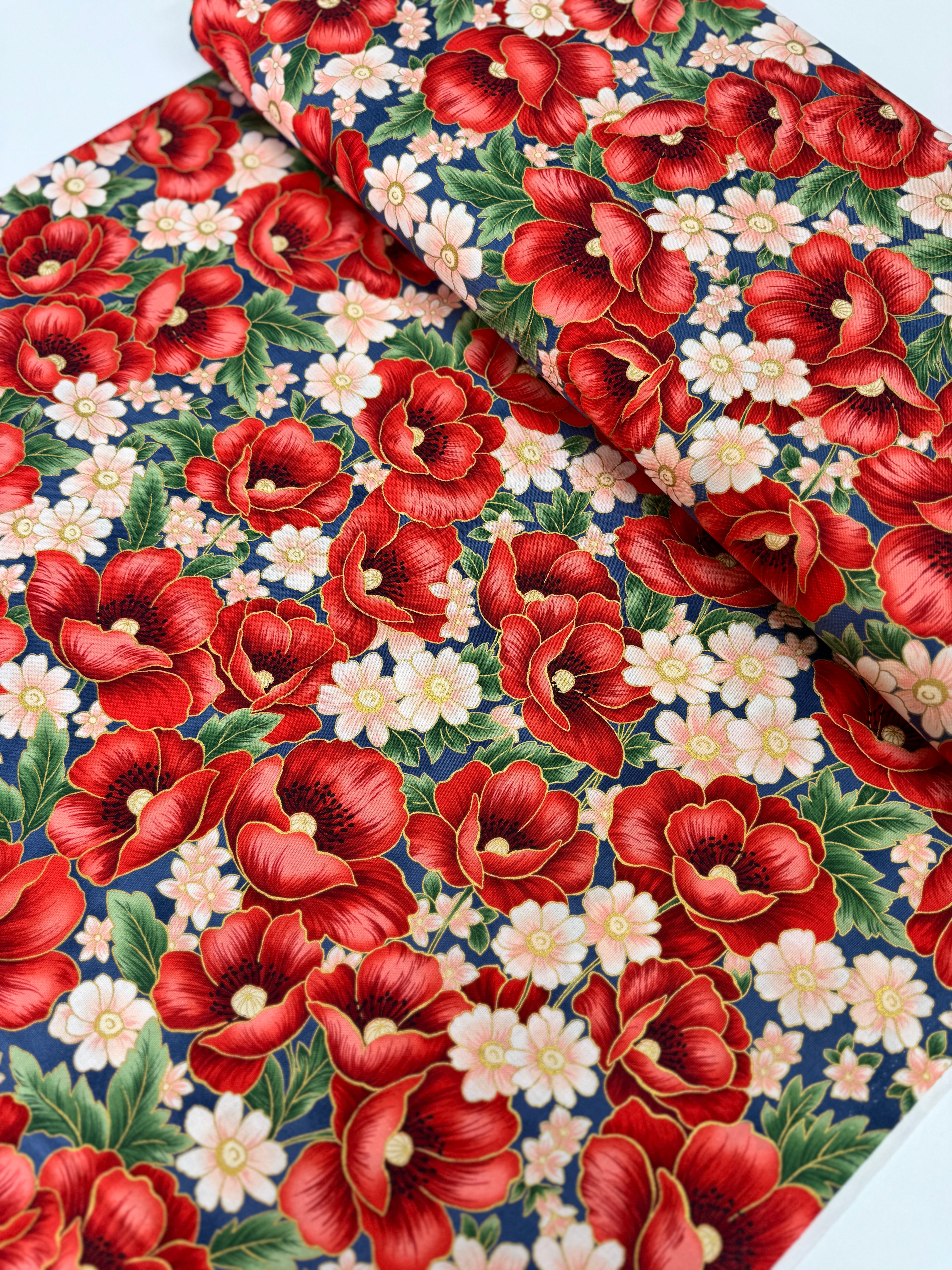 Blue metallic floral quilting cotton fabric with red poppy bouquets by Studio RK.
