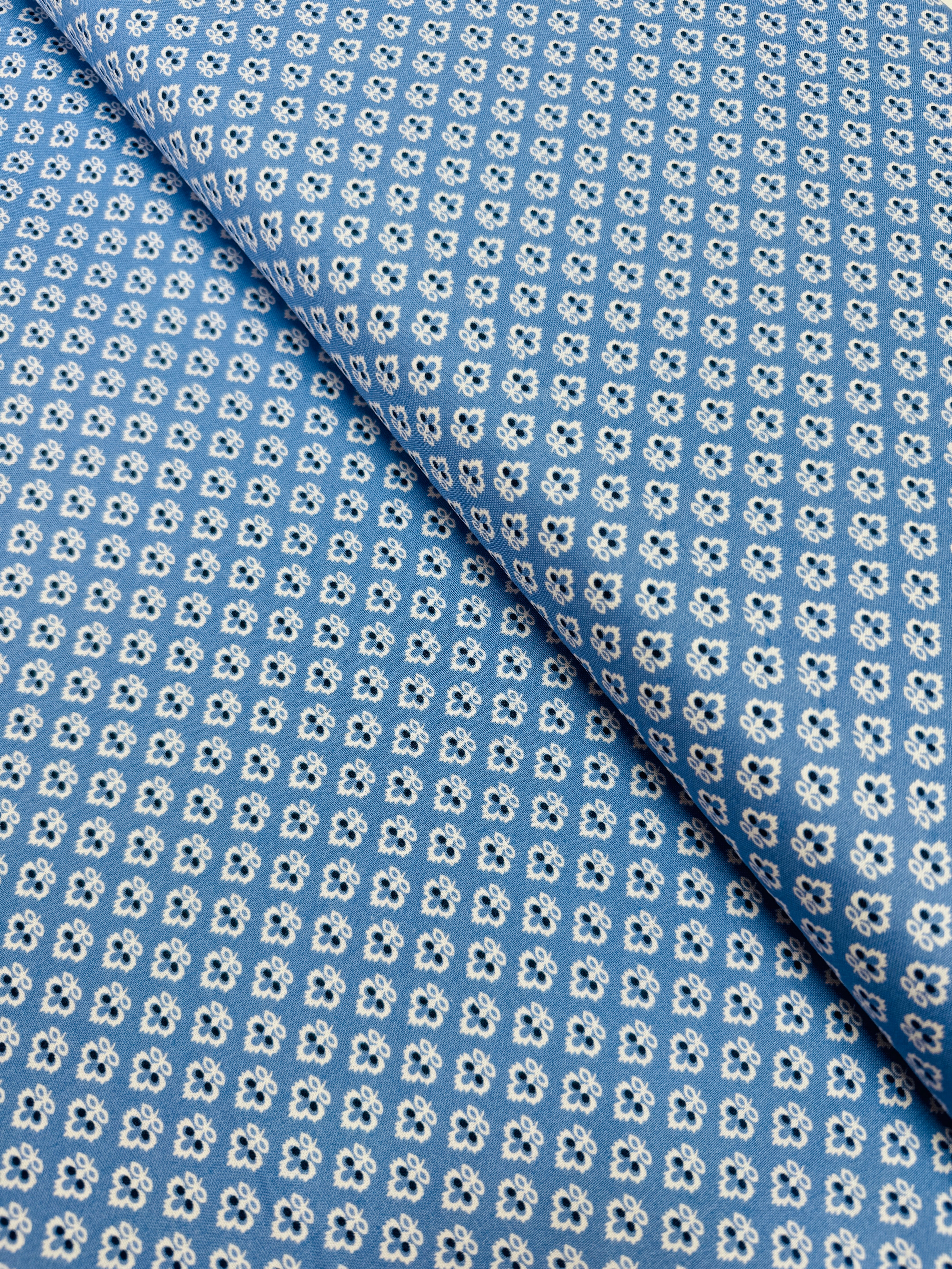 Blue cotton quilting fabric with tiny white floral ditsy print by Quilted Koala.