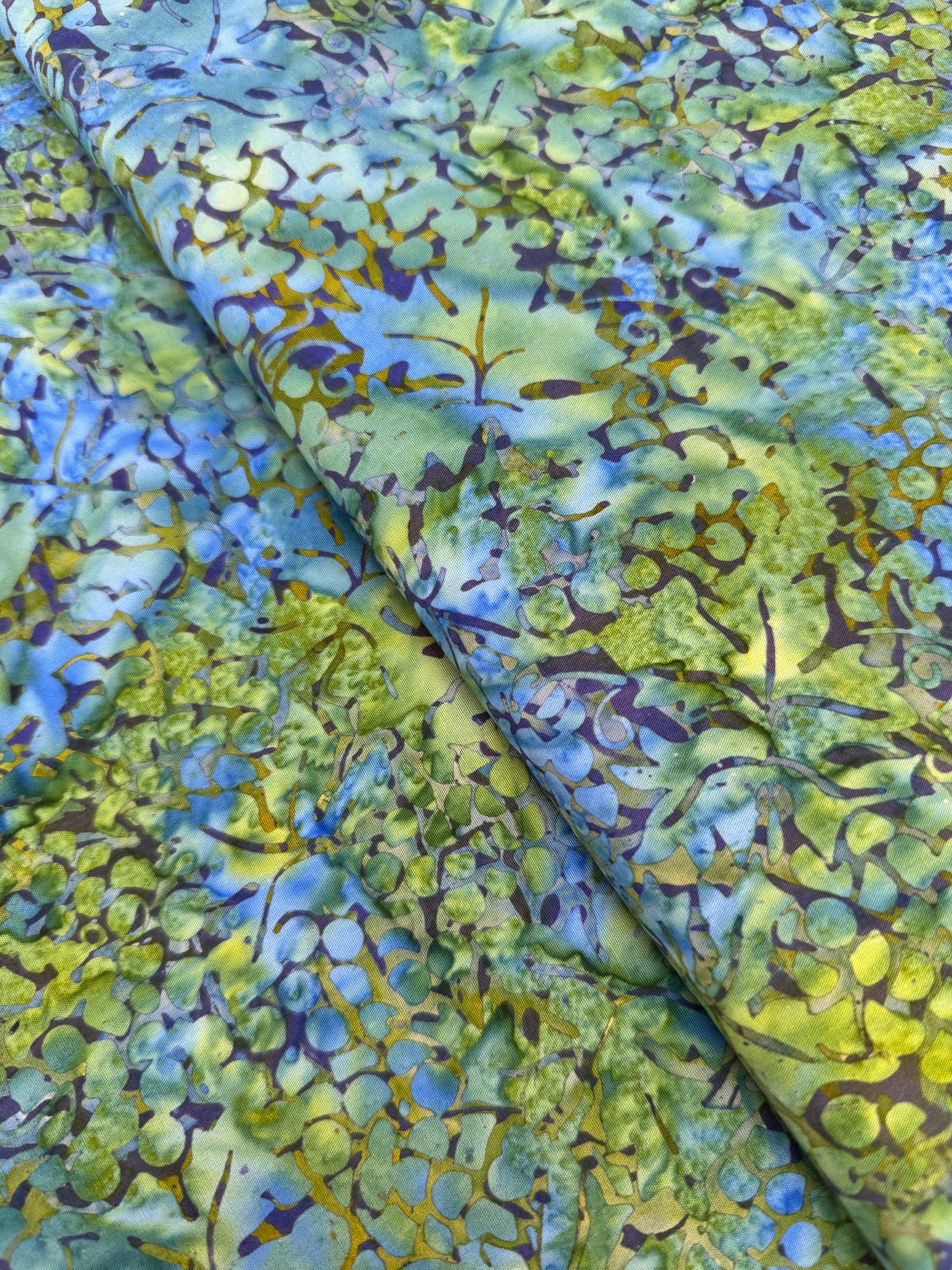 Blue and green Island Batik fabric with watercolor botanical pattern