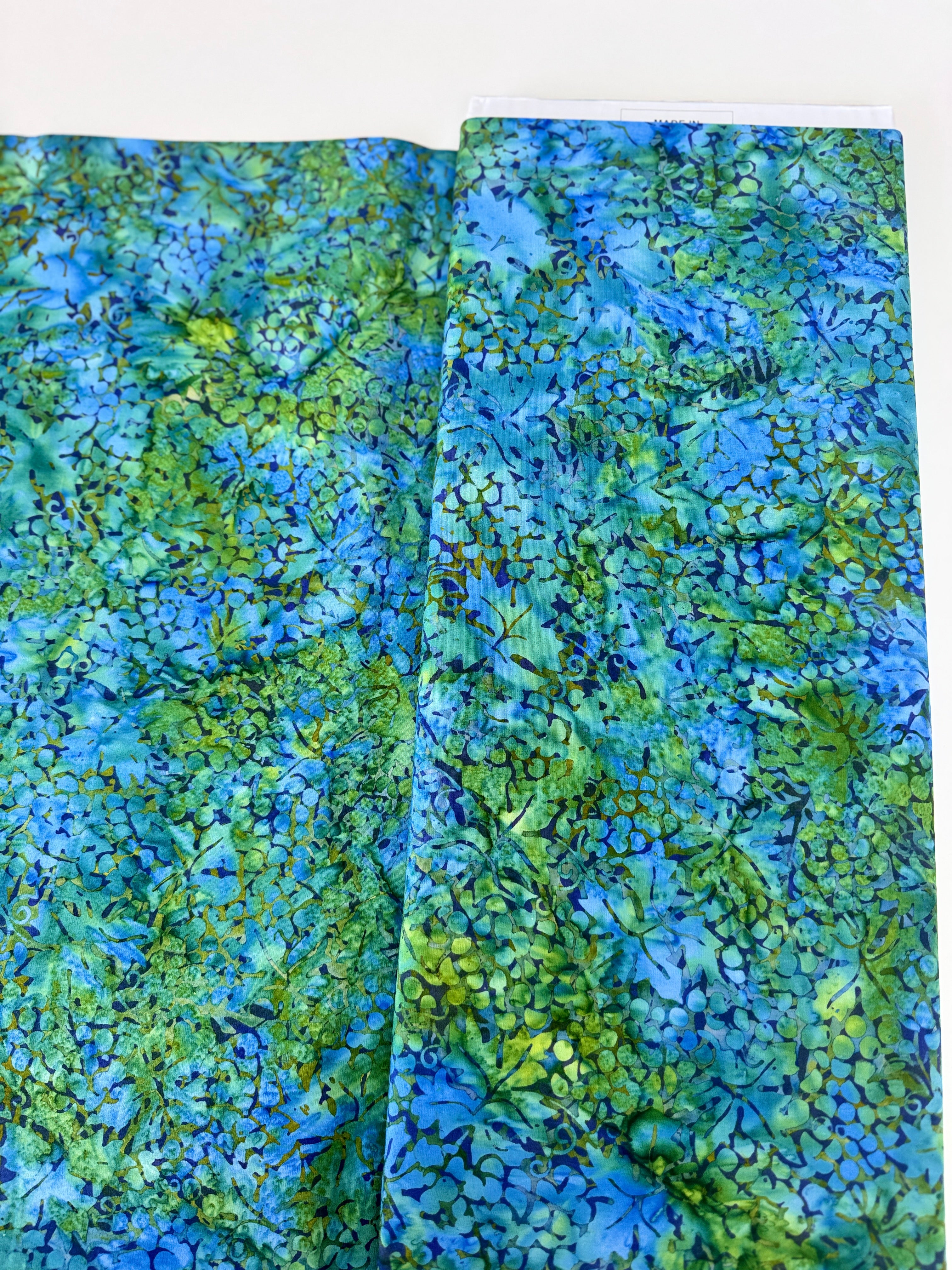 Blue and green Island Batik fabric with watercolor botanical pattern