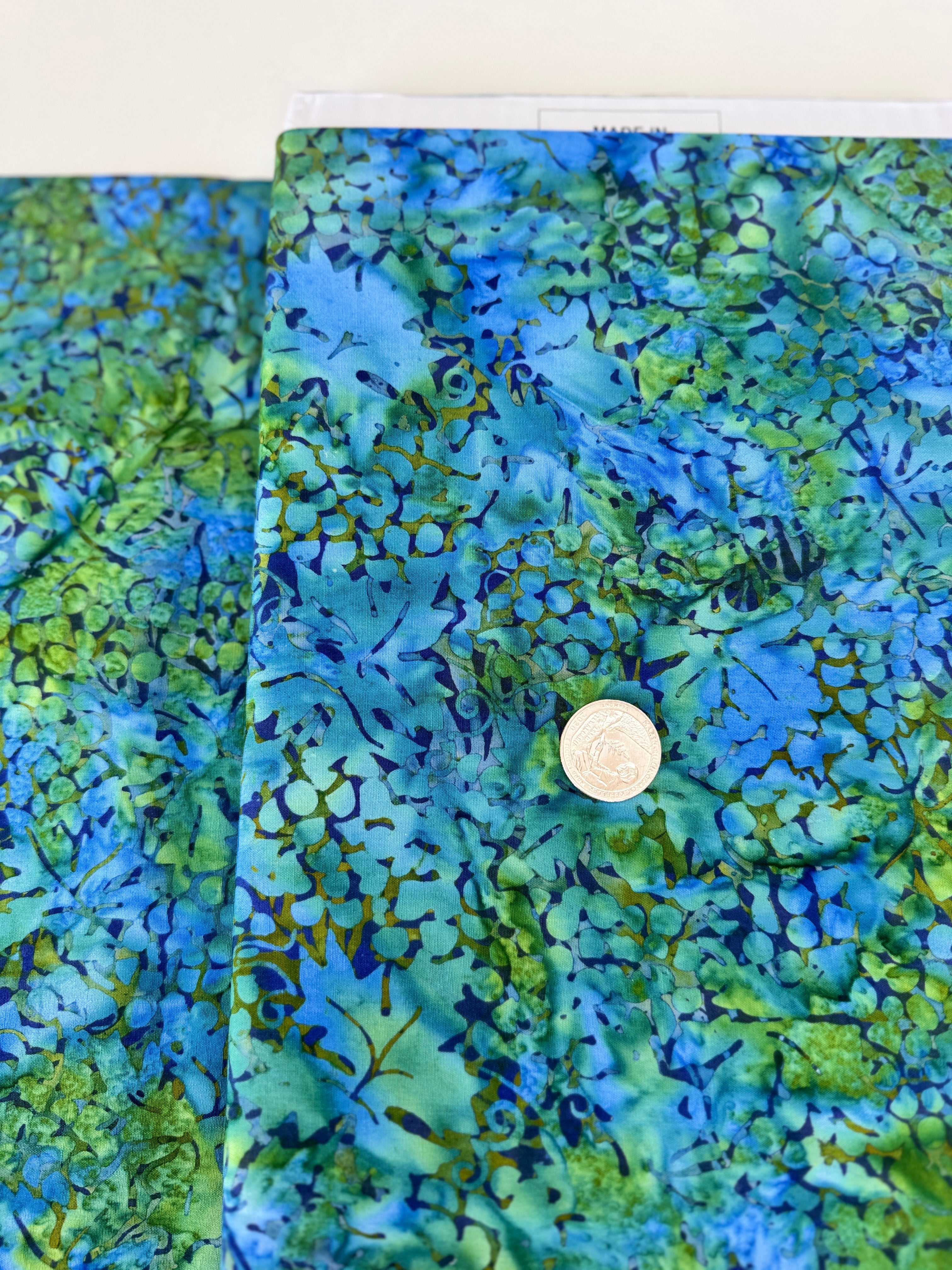 Blue and green Island Batik fabric with watercolor botanical pattern