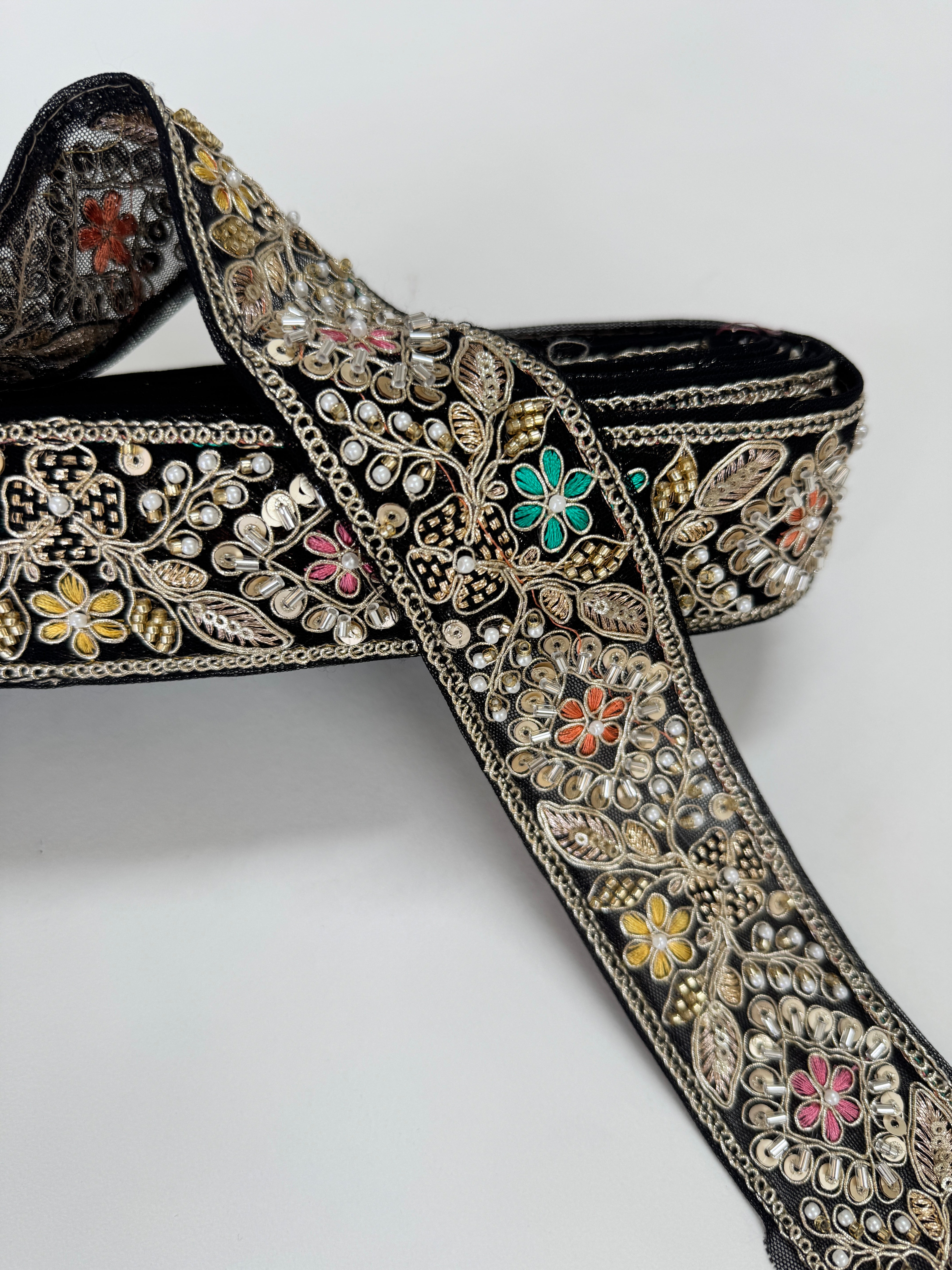 Black embroidered lace trim with gold thread and multicolor floral beadwork decorative border