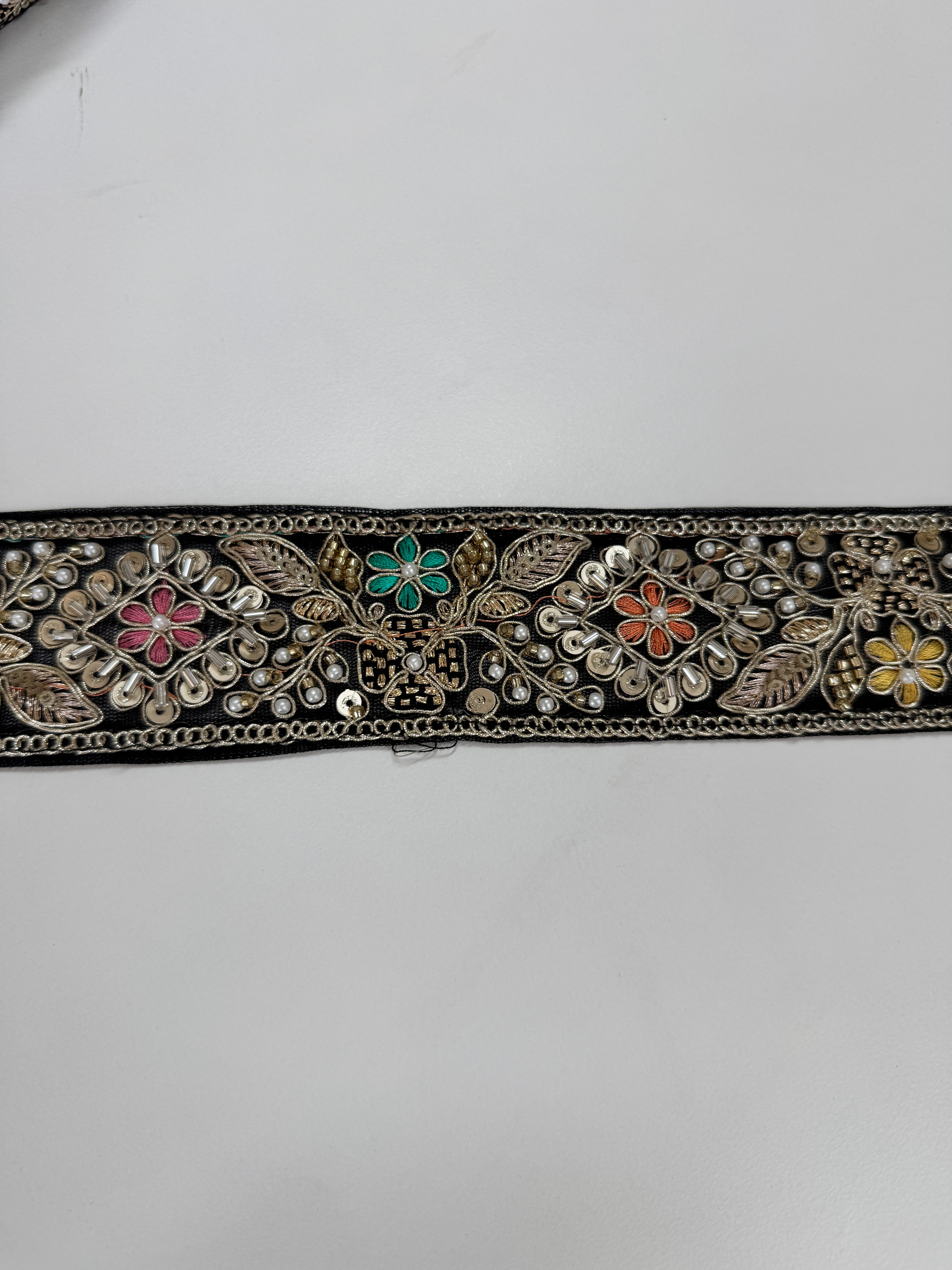 Black embroidered lace trim with gold thread and multicolor floral beadwork decorative border