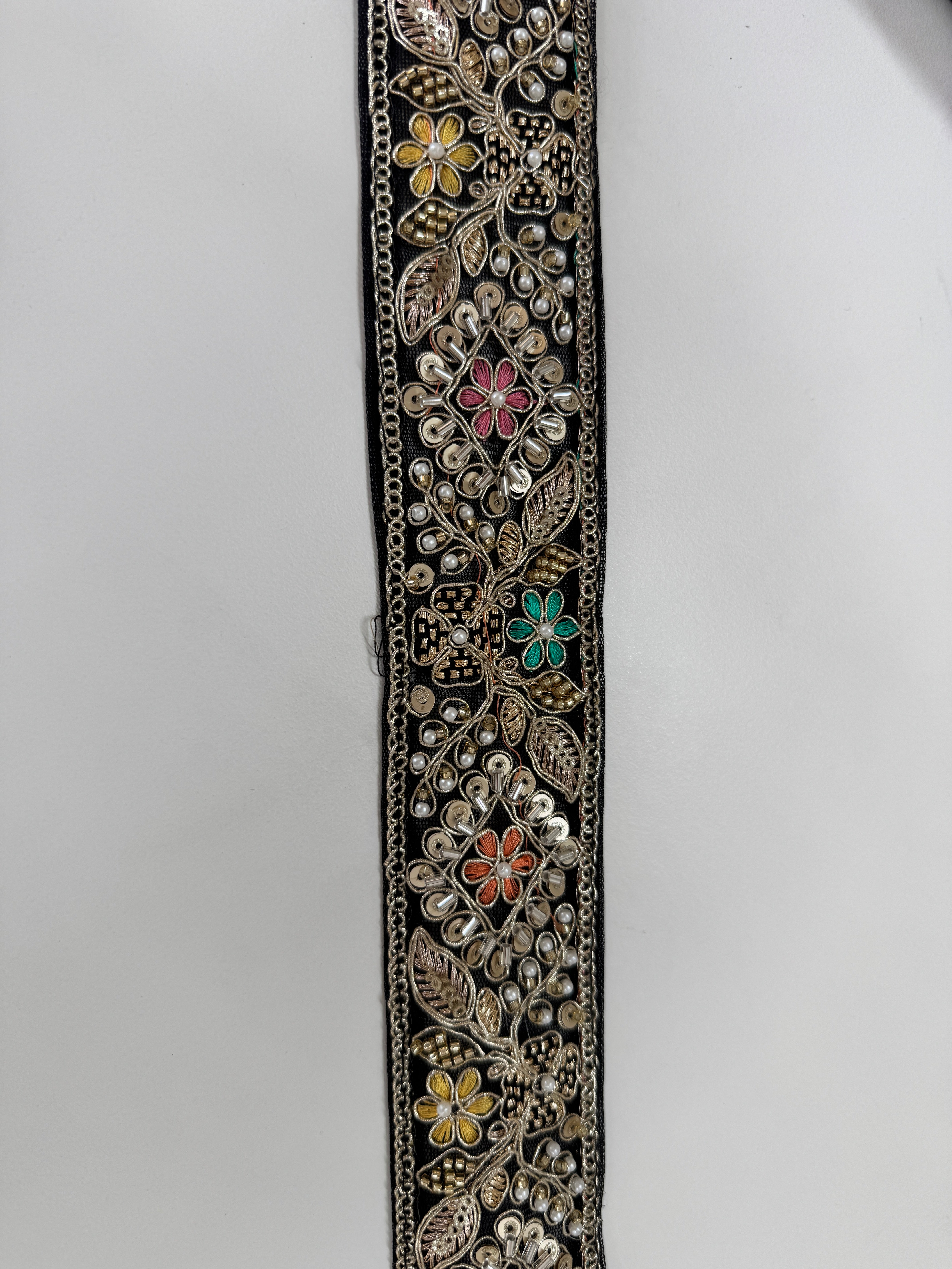 Black embroidered lace trim with gold thread and multicolor floral beadwork decorative border