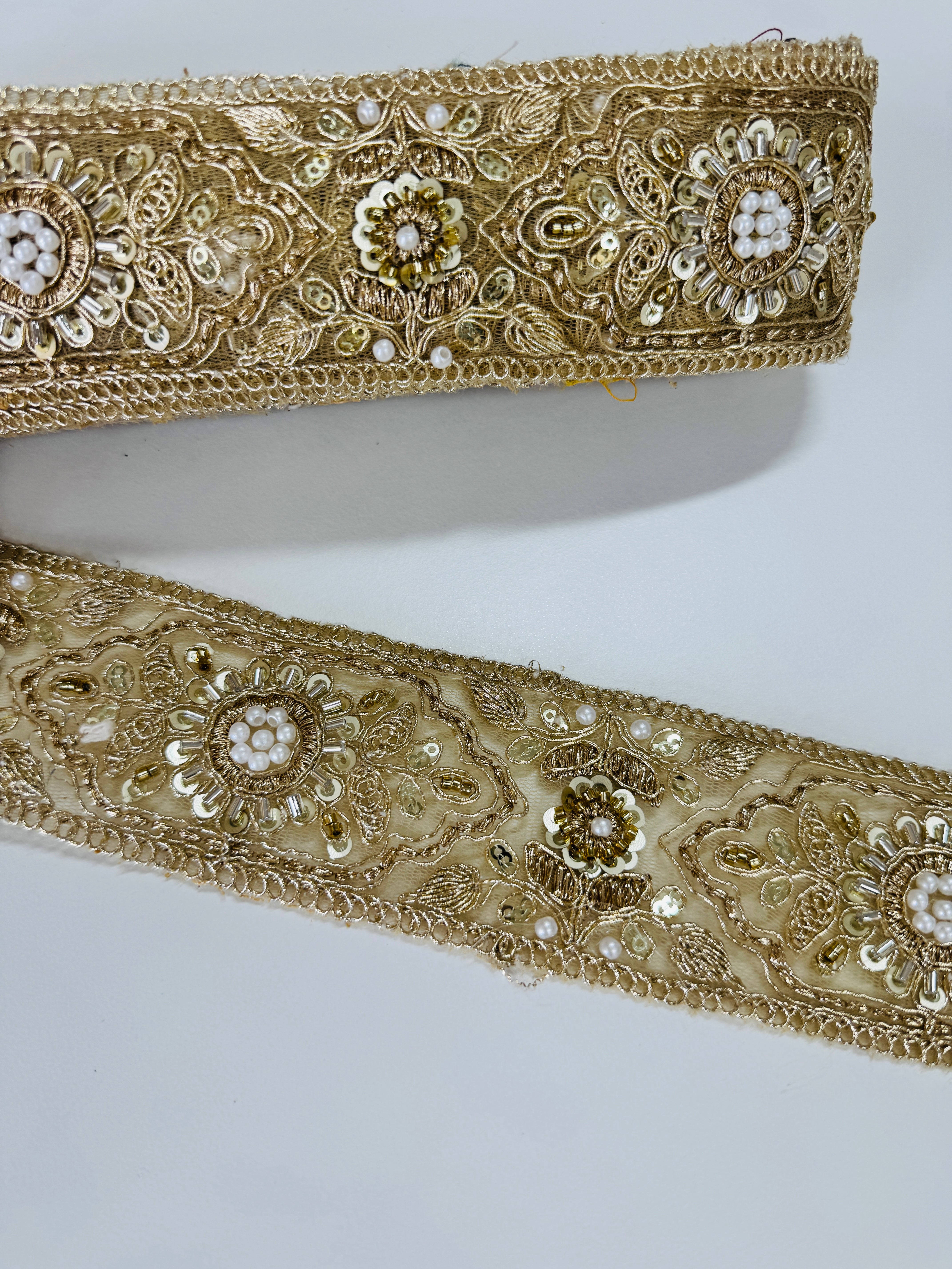 Gold embroidered lace trim with floral beadwork and sequin details for garment borders and crafts