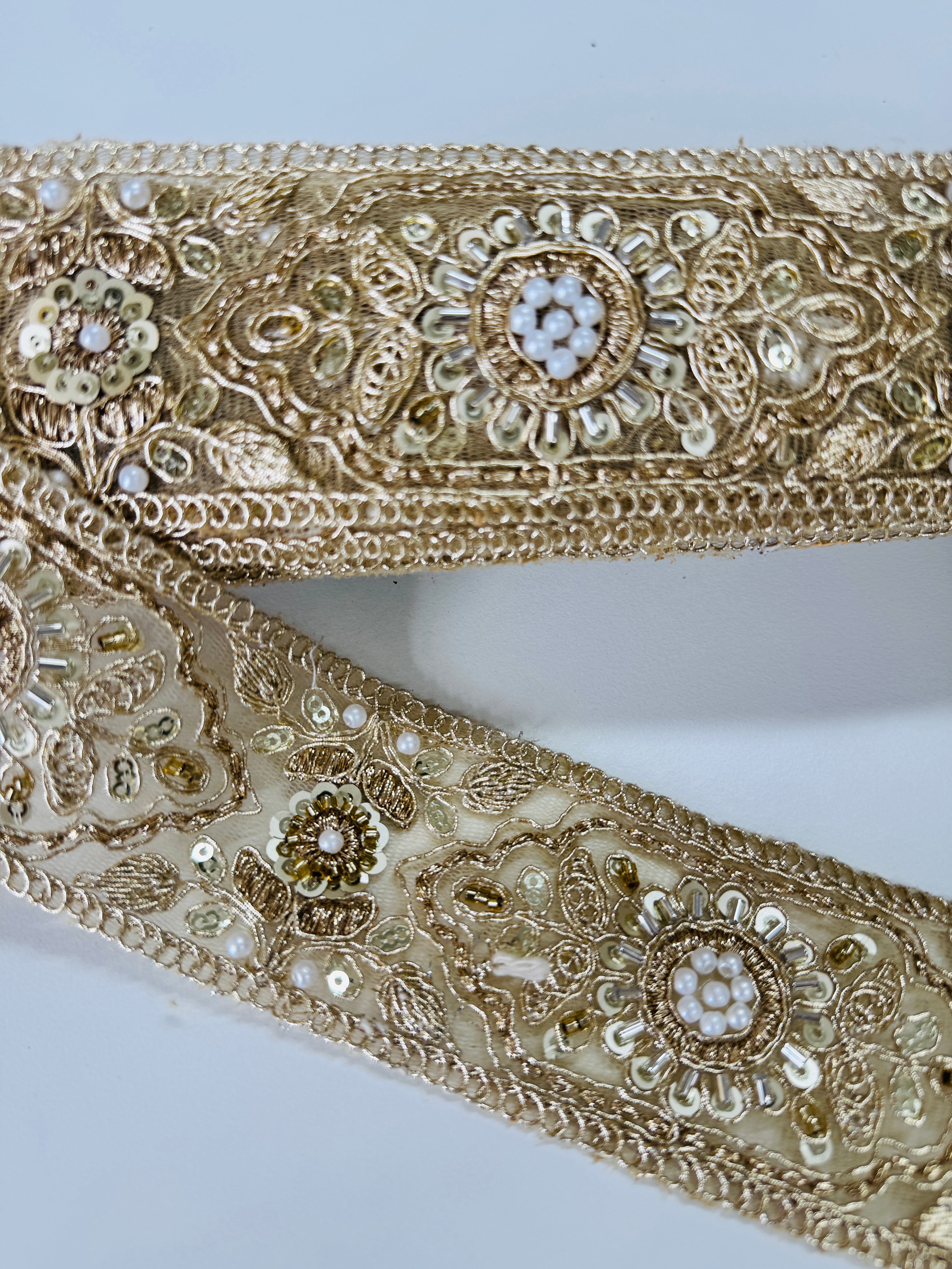 Gold embroidered lace trim with floral beadwork and sequin details for garment borders and crafts