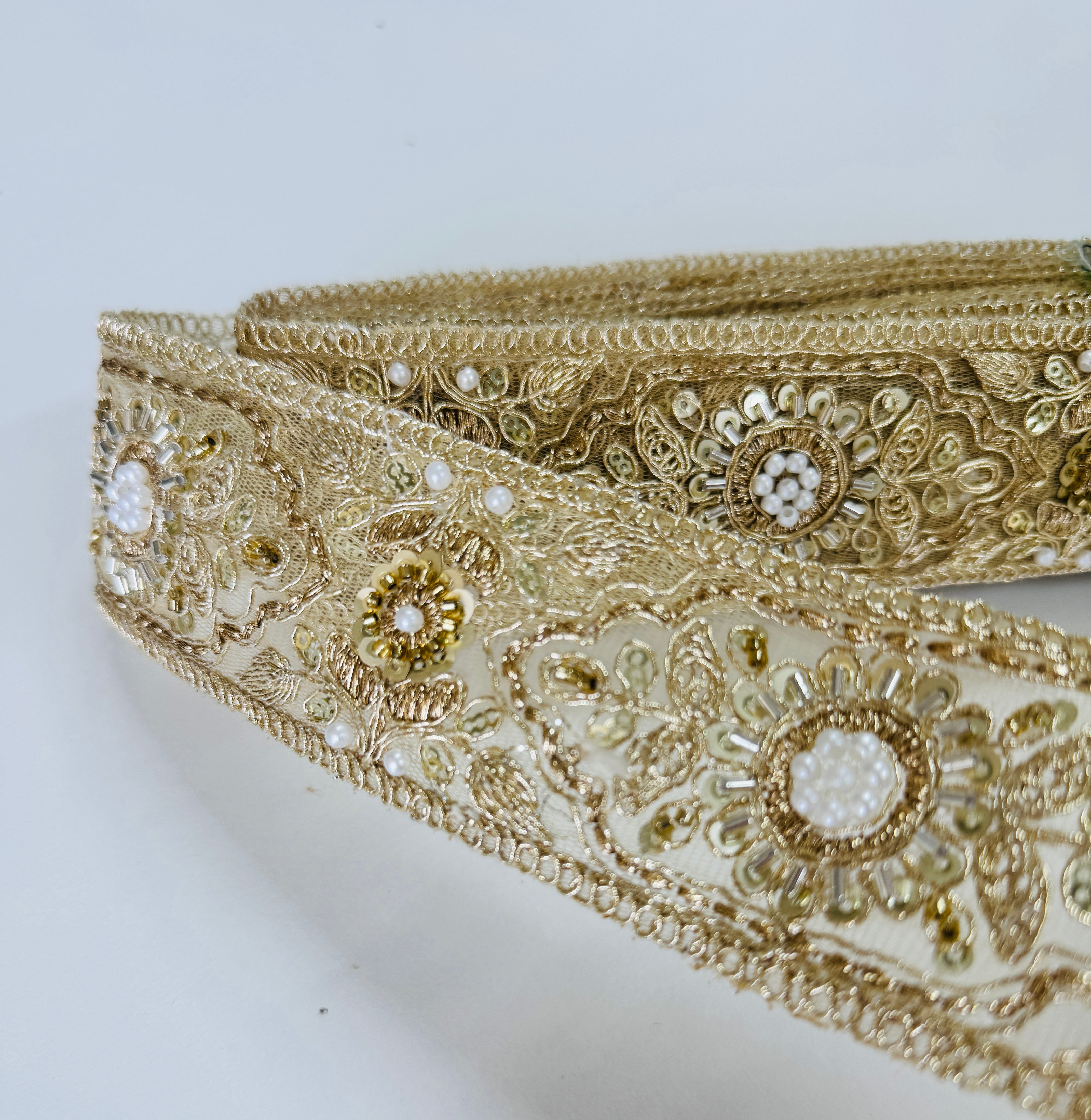 Gold embroidered lace trim with floral beadwork and sequin details for garment borders and crafts