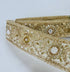 Gold embroidered lace trim with floral beadwork and sequin details for garment borders and crafts