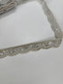 Silver beaded lace trim with sequins, embroidery, and scalloped edge for bridal gowns, veils, lehengas, sarees, couture garments, and sewing projects.
