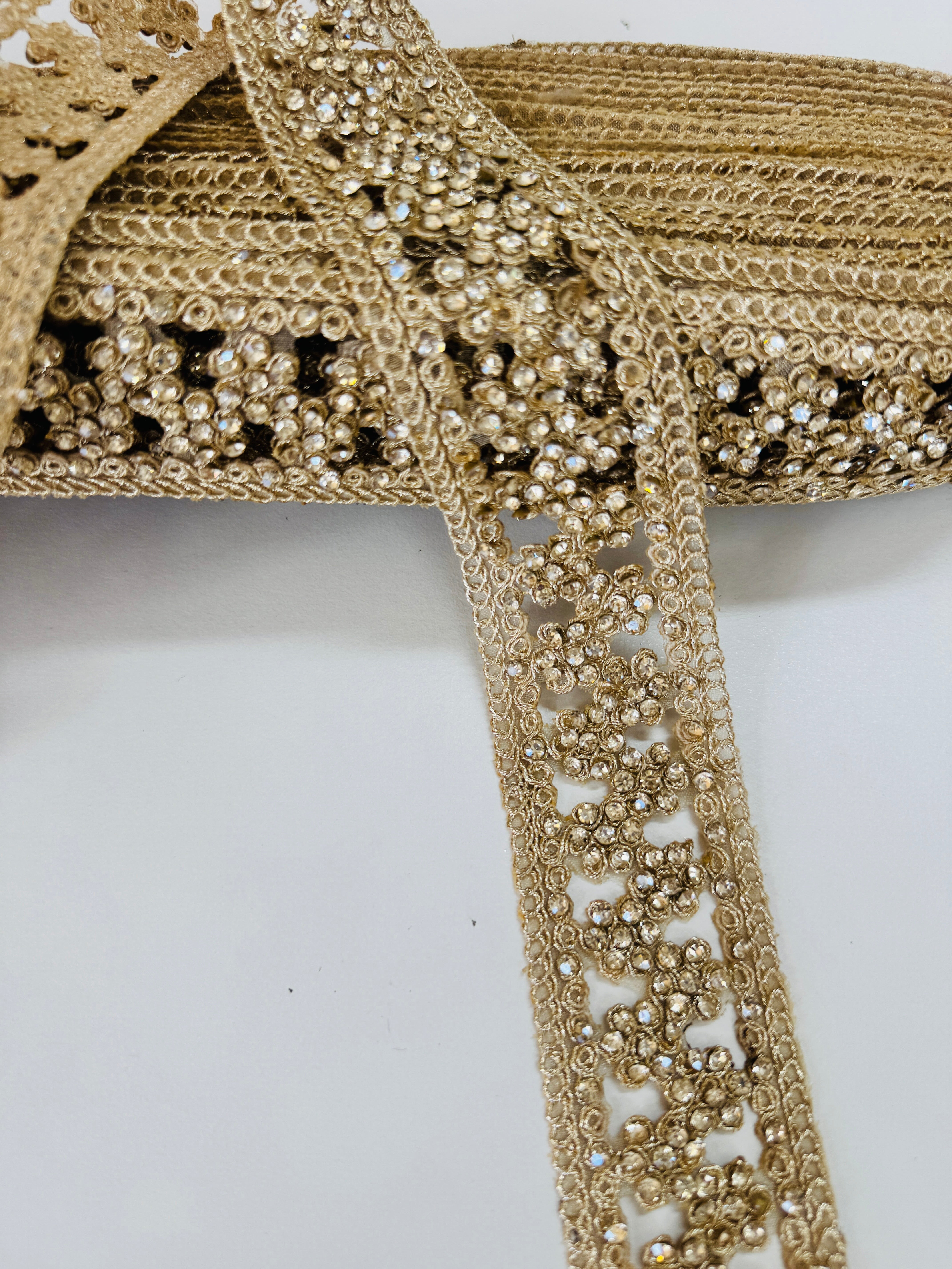 Champagne beaded lace trim with crystal embellishments and embroidered openwork design for bridal gowns, veils, lehengas, sarees, and couture sewing projects.