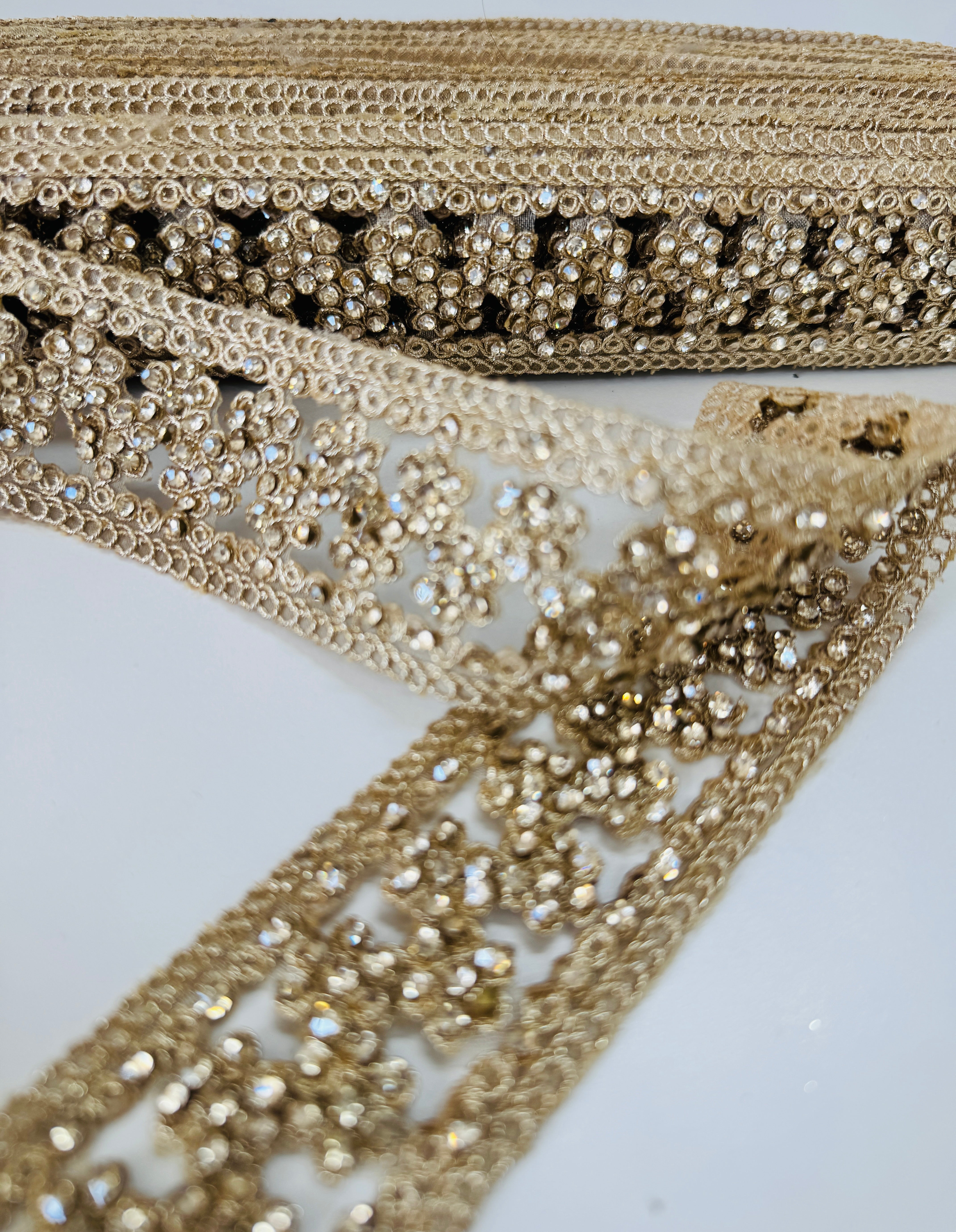 Champagne beaded lace trim with crystal embellishments and embroidered openwork design for bridal gowns, veils, lehengas, sarees, and couture sewing projects.
