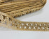 Champagne beaded lace trim with crystal embellishments and embroidered openwork design for bridal gowns, veils, lehengas, sarees, and couture sewing projects.