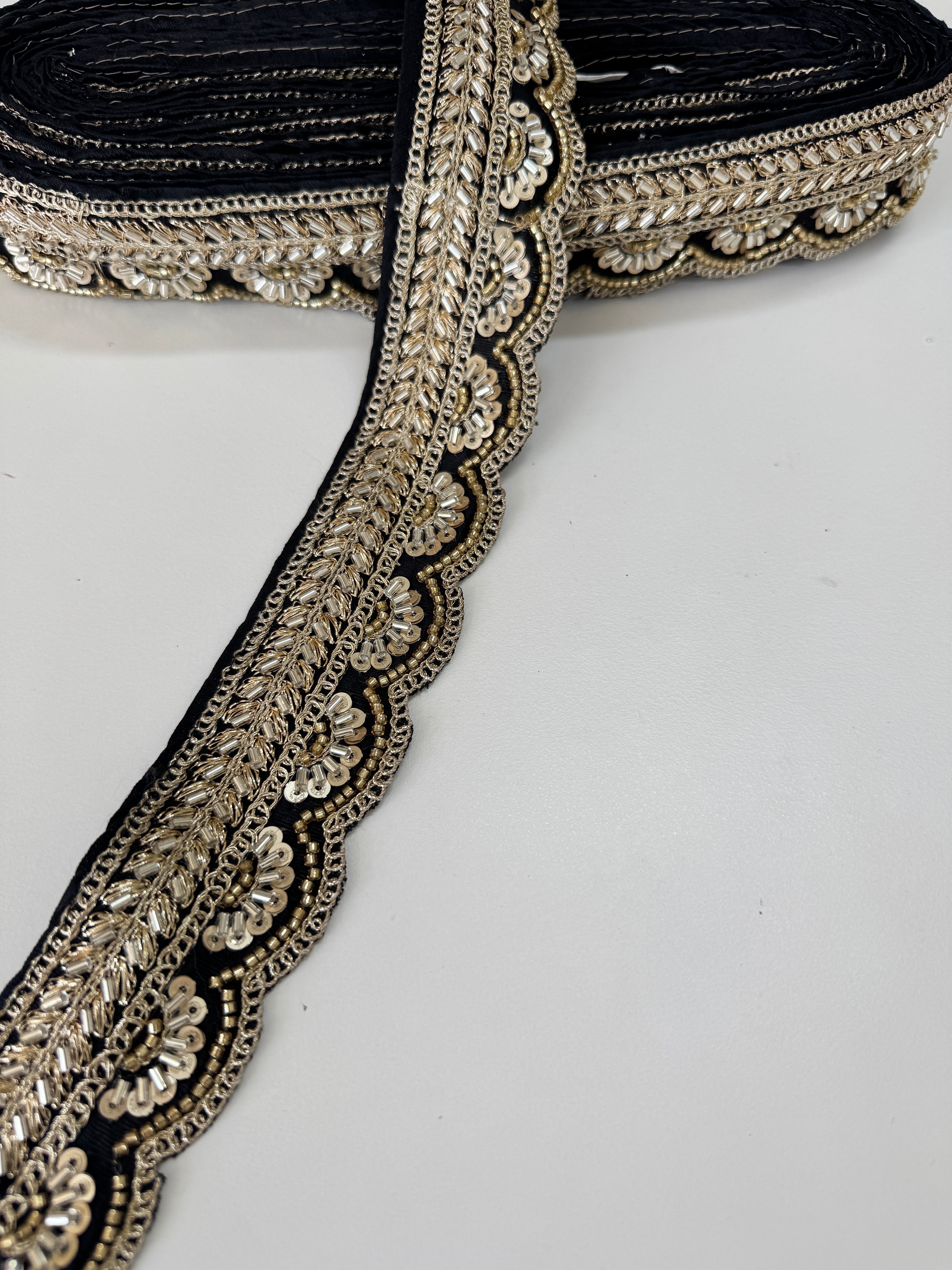 Black and gold beaded scalloped trim with sequins and bugle beads for sarees, lehengas, gowns, veils, and couture sewing projects.