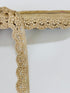 Champagne gold crystal beaded lace trim with intricate embroidery and sparkling embellishments for bridal gowns, sarees, lehengas, veils, and couture sewing projects.