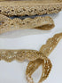 Champagne gold crystal beaded lace trim with intricate embroidery and sparkling embellishments for bridal gowns, sarees, lehengas, veils, and couture sewing projects.