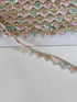Pastel pink, mint, ivory, and gold beaded sequin trim with metallic edging.