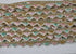 Pastel pink, mint, ivory, and gold beaded sequin trim with metallic edging.