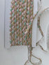 Pastel pink, mint, ivory, and gold beaded sequin trim with metallic edging.