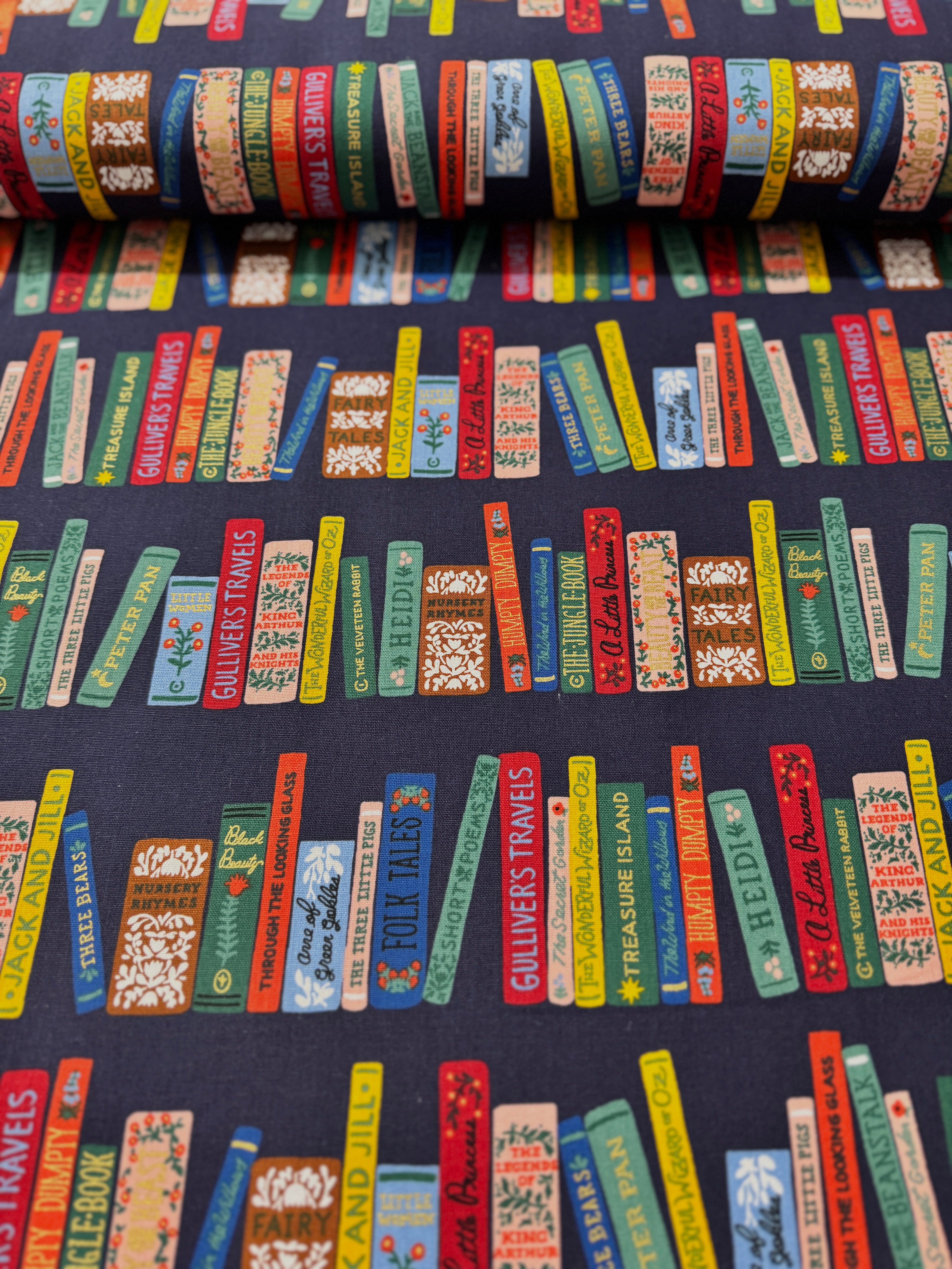 Curio Book Club Navy Canvas Metallic Fabric by Rifle Paper Co. for Cotton + Steel – bookshelf print with metallic accents on deep navy cotton-linen canvas.