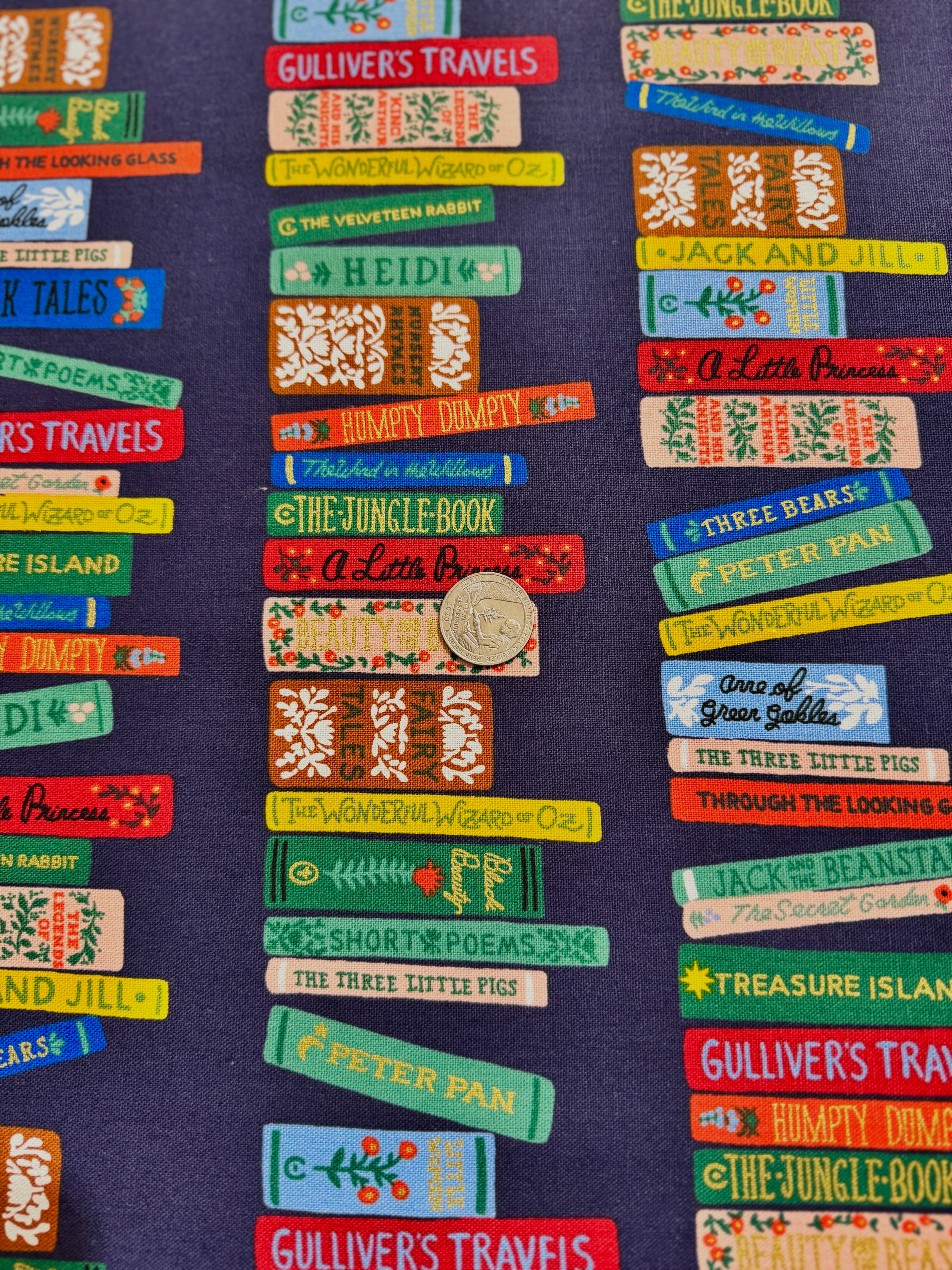 Curio Book Club Navy Canvas Metallic Fabric by Rifle Paper Co. for Cotton + Steel – bookshelf print with metallic accents on deep navy cotton-linen canvas.