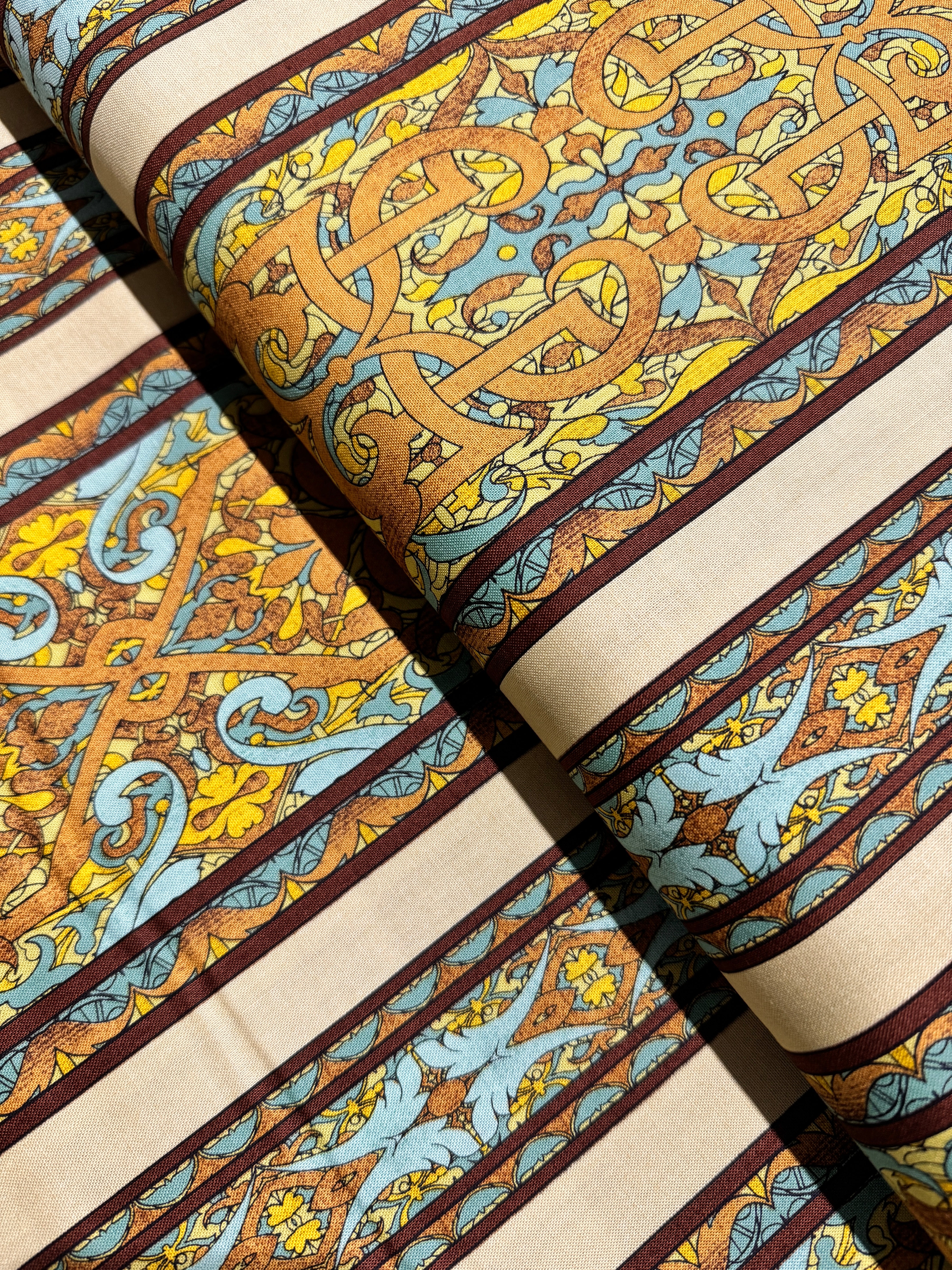 Miyako Border Yellow Fabric by Jinny Beyer – Asian-style geometric and floral border cotton print for RJR Fabrics.