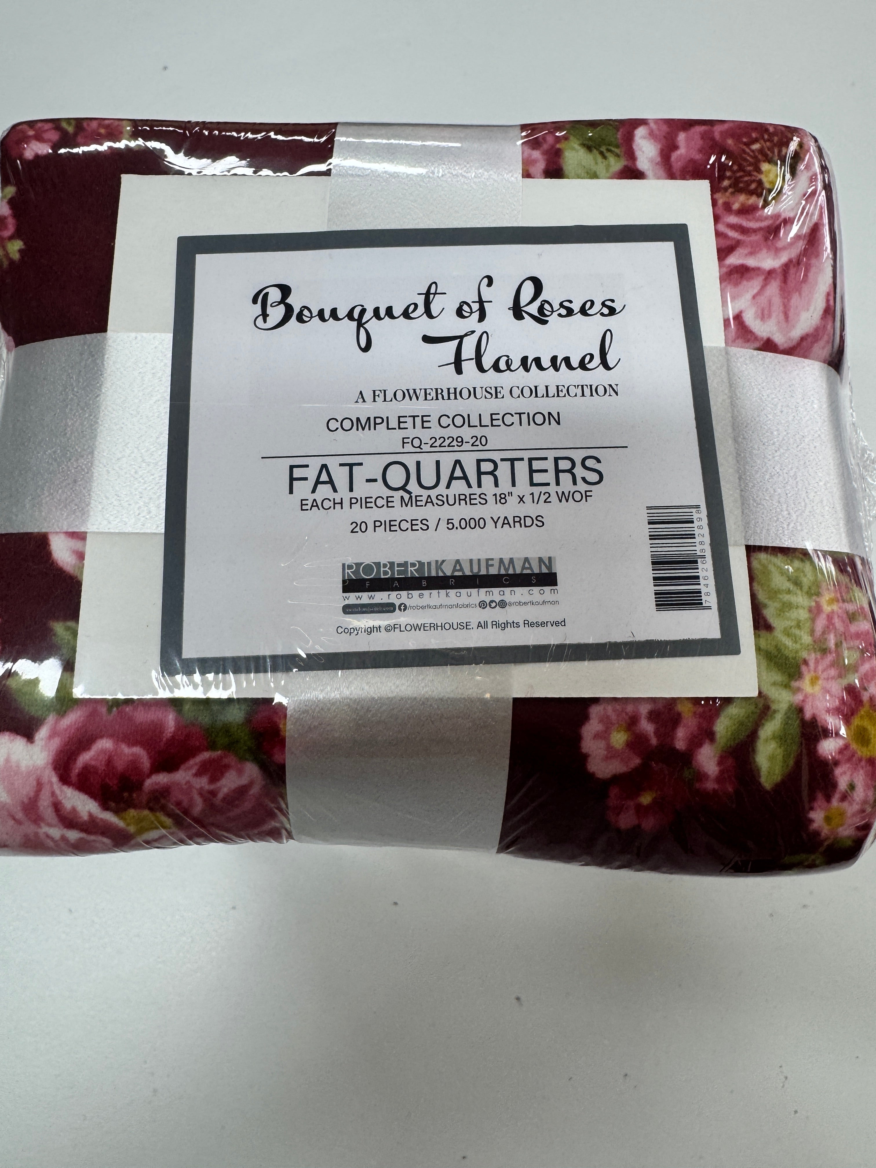 Bouquet of Roses Flannel Fat Quarter Bundle by A Flowerhouse Collection for Robert Kaufman featuring 20 coordinating floral flannel fat quarters in burgundy, pink, ivory, green, and charcoal tones.