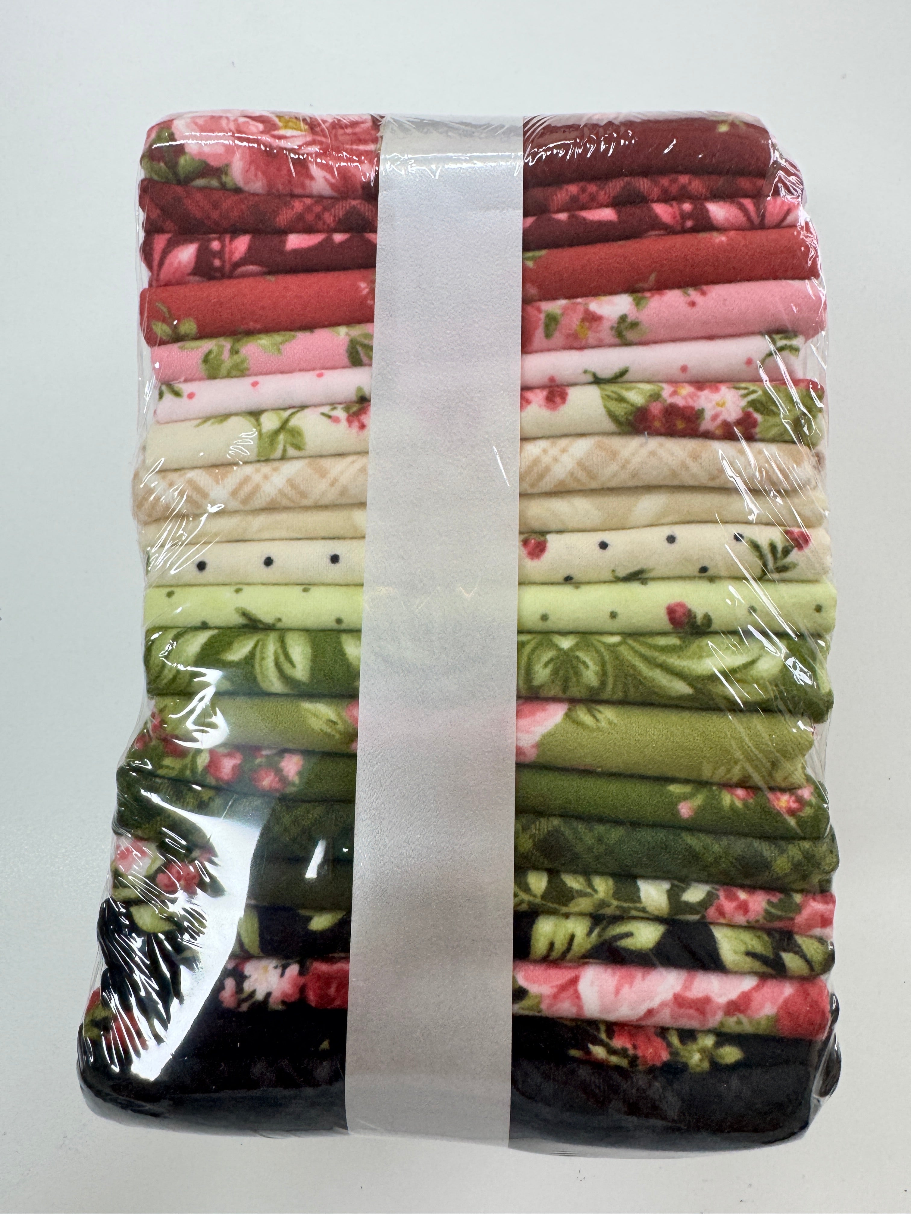 Bouquet of Roses Flannel Fat Quarter Bundle by A Flowerhouse Collection for Robert Kaufman featuring 20 coordinating floral flannel fat quarters in burgundy, pink, ivory, green, and charcoal tones.