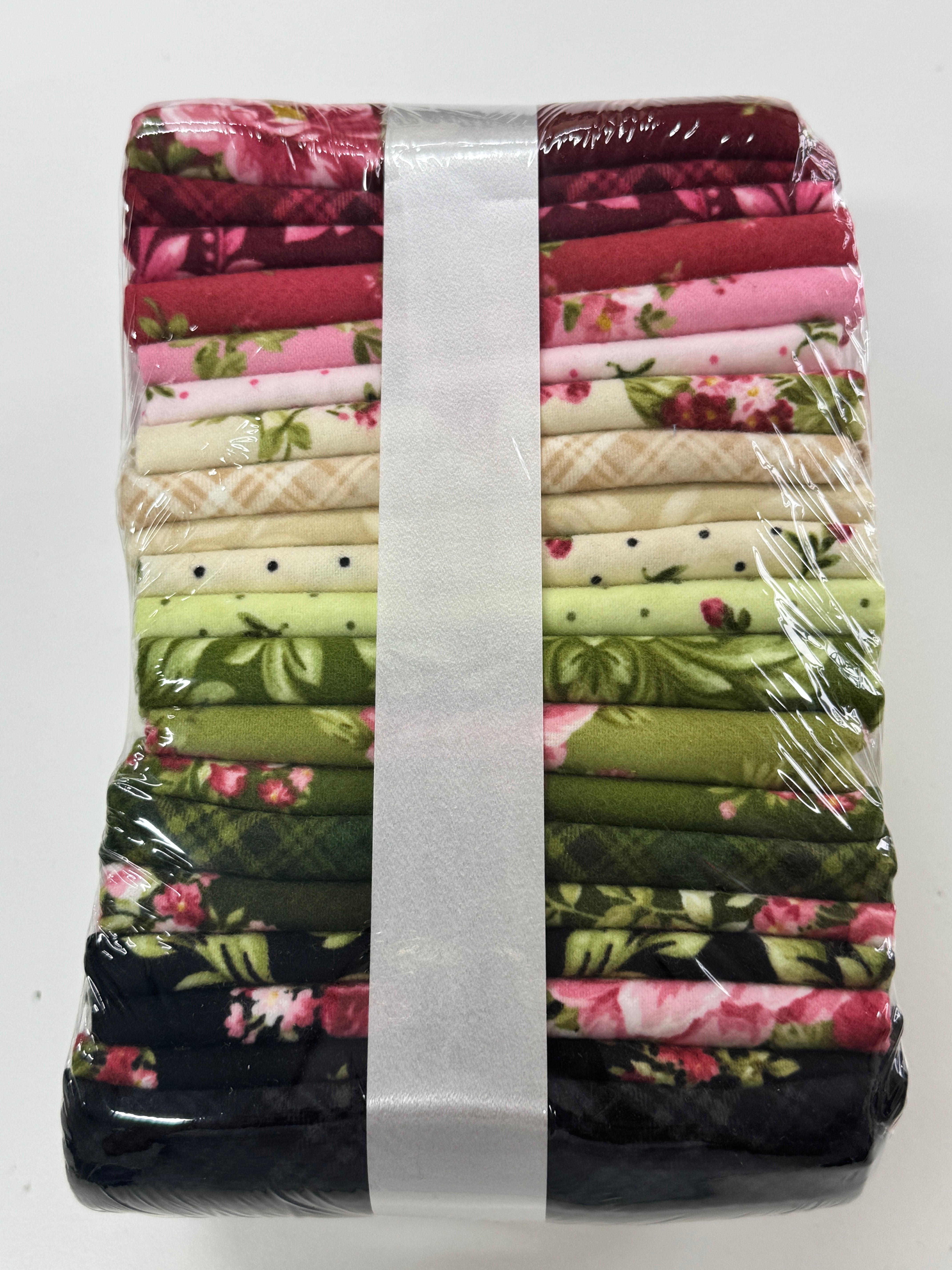 Bouquet of Roses Flannel Fat Quarter Bundle by A Flowerhouse Collection for Robert Kaufman featuring 20 coordinating floral flannel fat quarters in burgundy, pink, ivory, green, and charcoal tones.