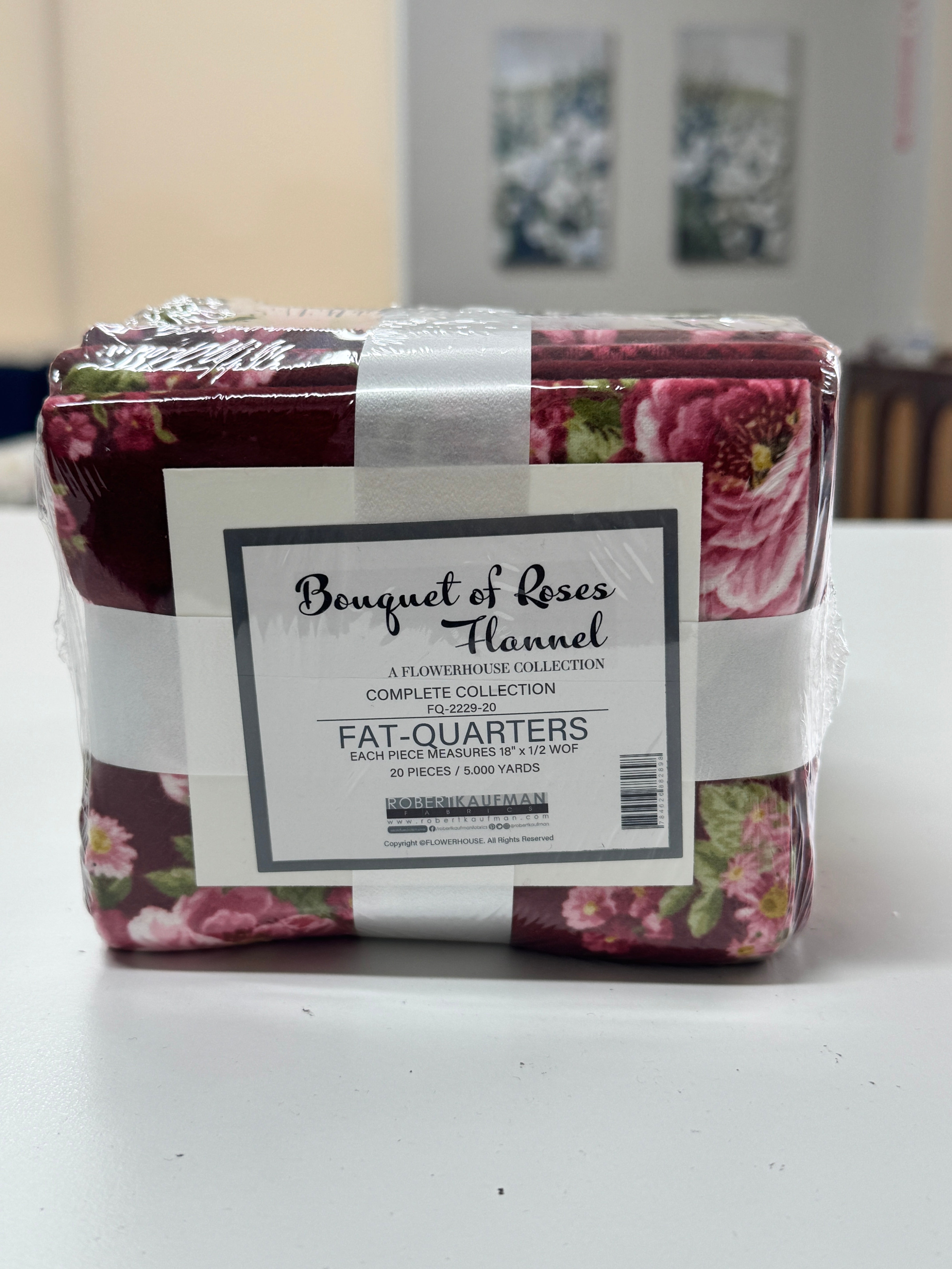 Bouquet of Roses Flannel Fat Quarter Bundle by A Flowerhouse Collection for Robert Kaufman featuring 20 coordinating floral flannel fat quarters in burgundy, pink, ivory, green, and charcoal tones.