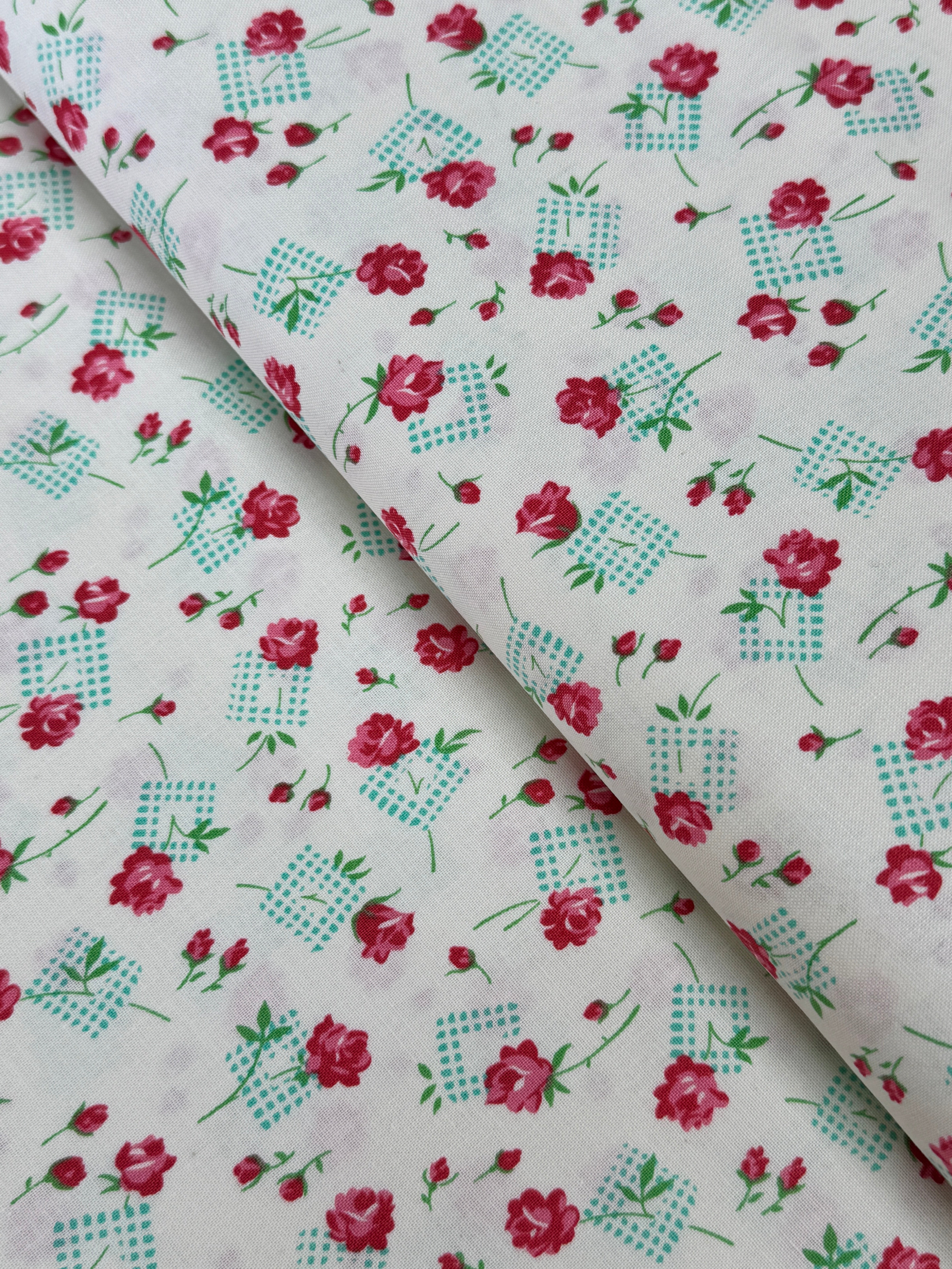 Pink roses and rosebuds with mint gingham accents scattered across a coconut cream background, Sugar Bloom Gingham Garden Coconut cotton fabric.